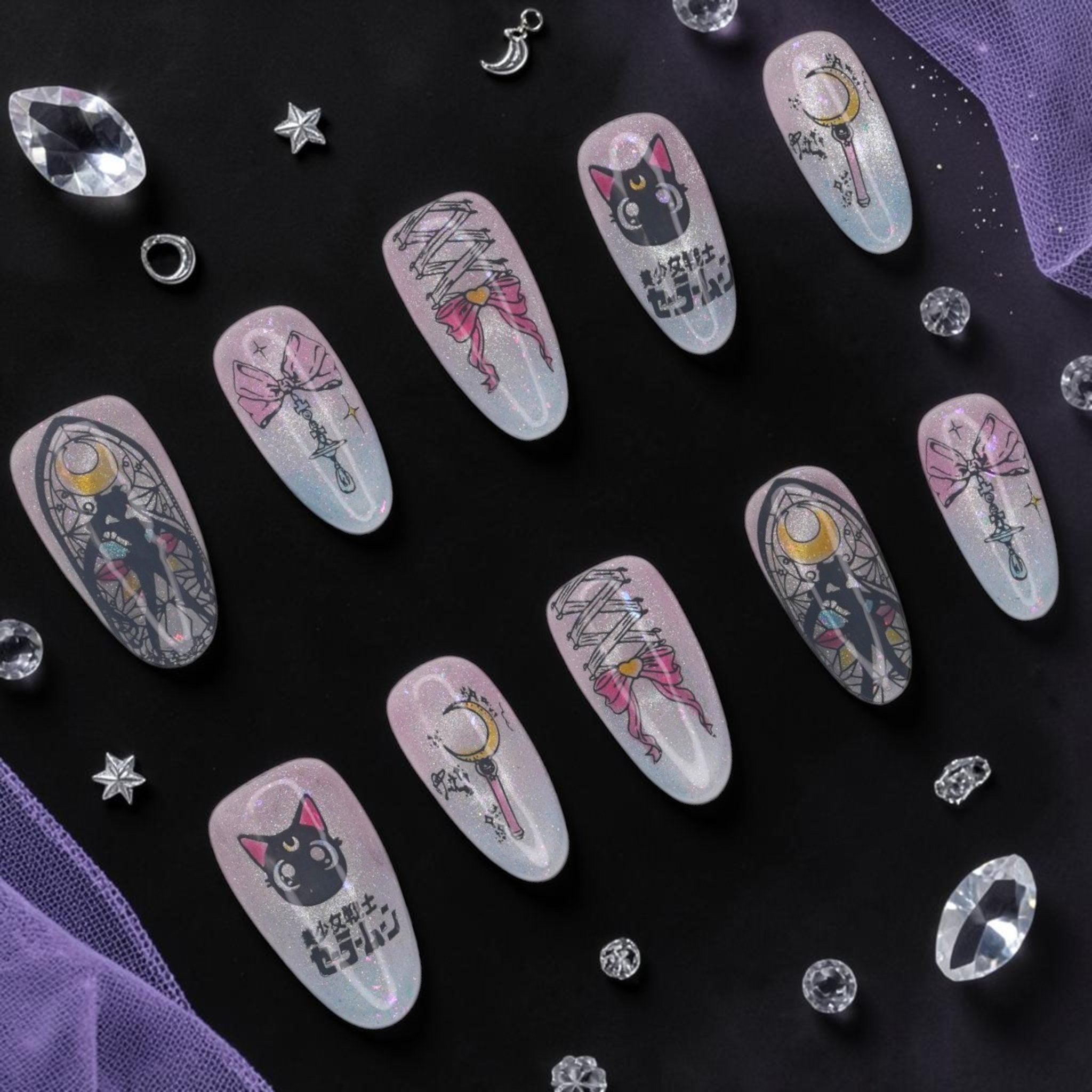 DSC00011 anime press on nails full set with a black cat, crescent moon wand and bows on aurora glitter laid flat