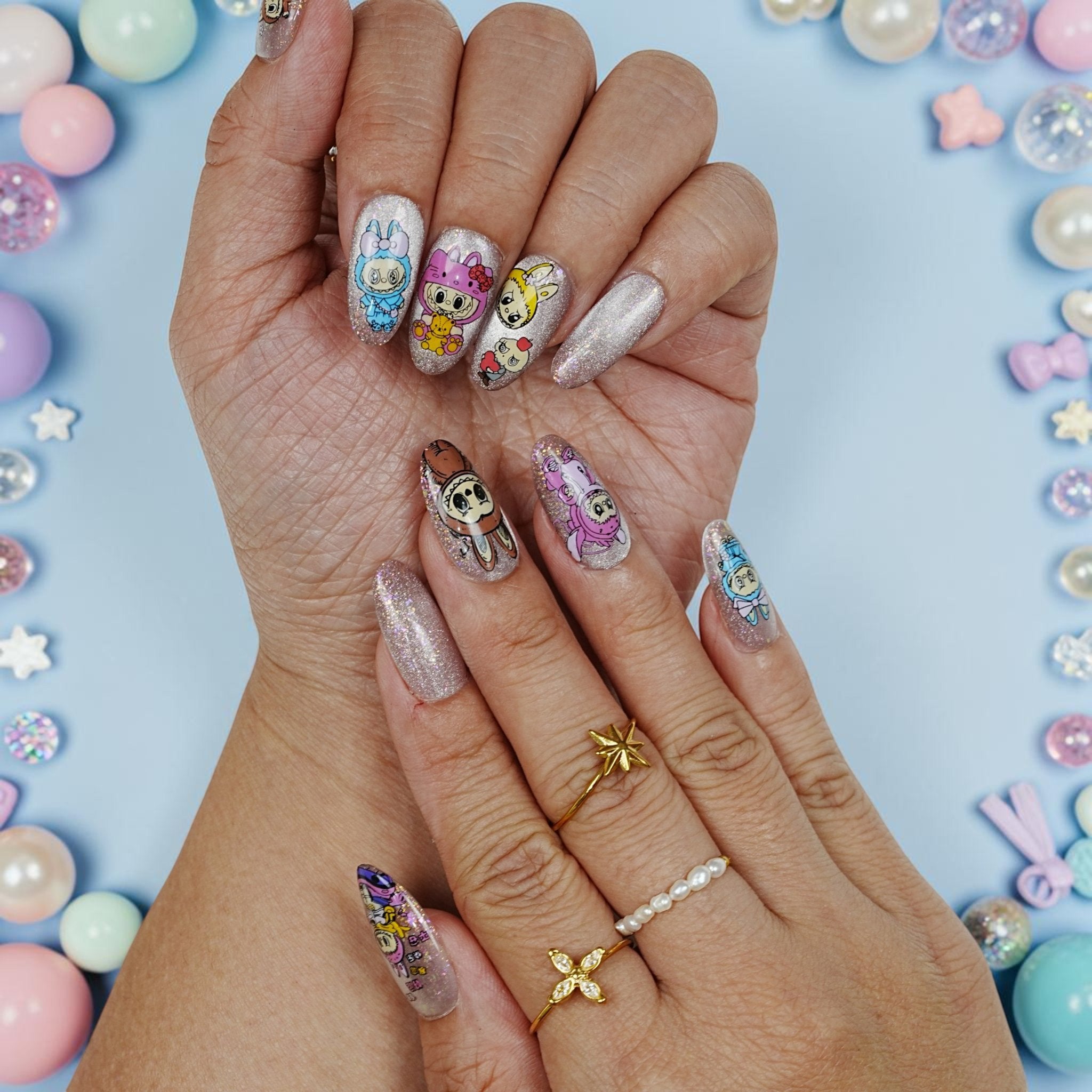 DSC00016 two hands showing cute character kawaii press on nails with bunny onesies