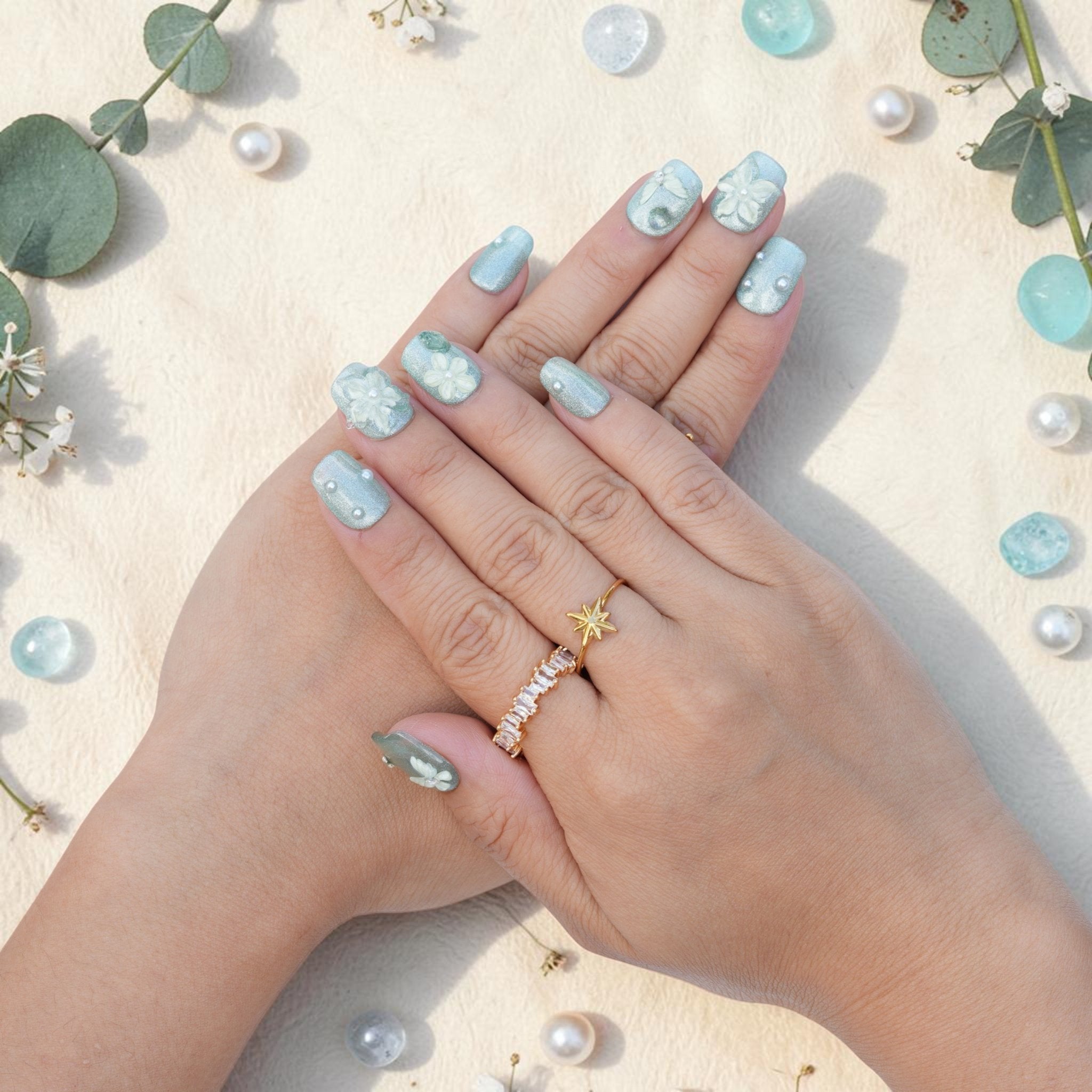 DSC00022 hands wearing sage green cat eye press on nails with 3D flowers and pearls