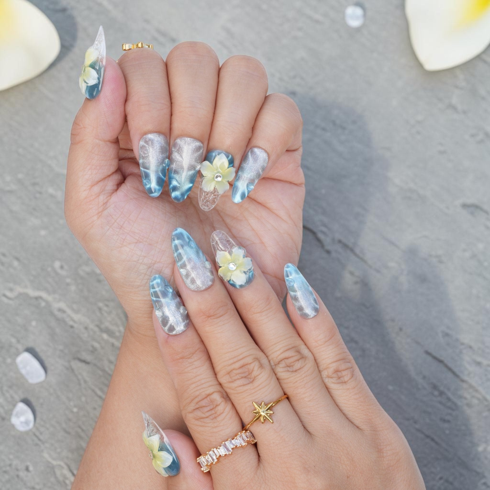 DSC00035 ocean blue cat eye almond press on nails with cream frangipani flowers