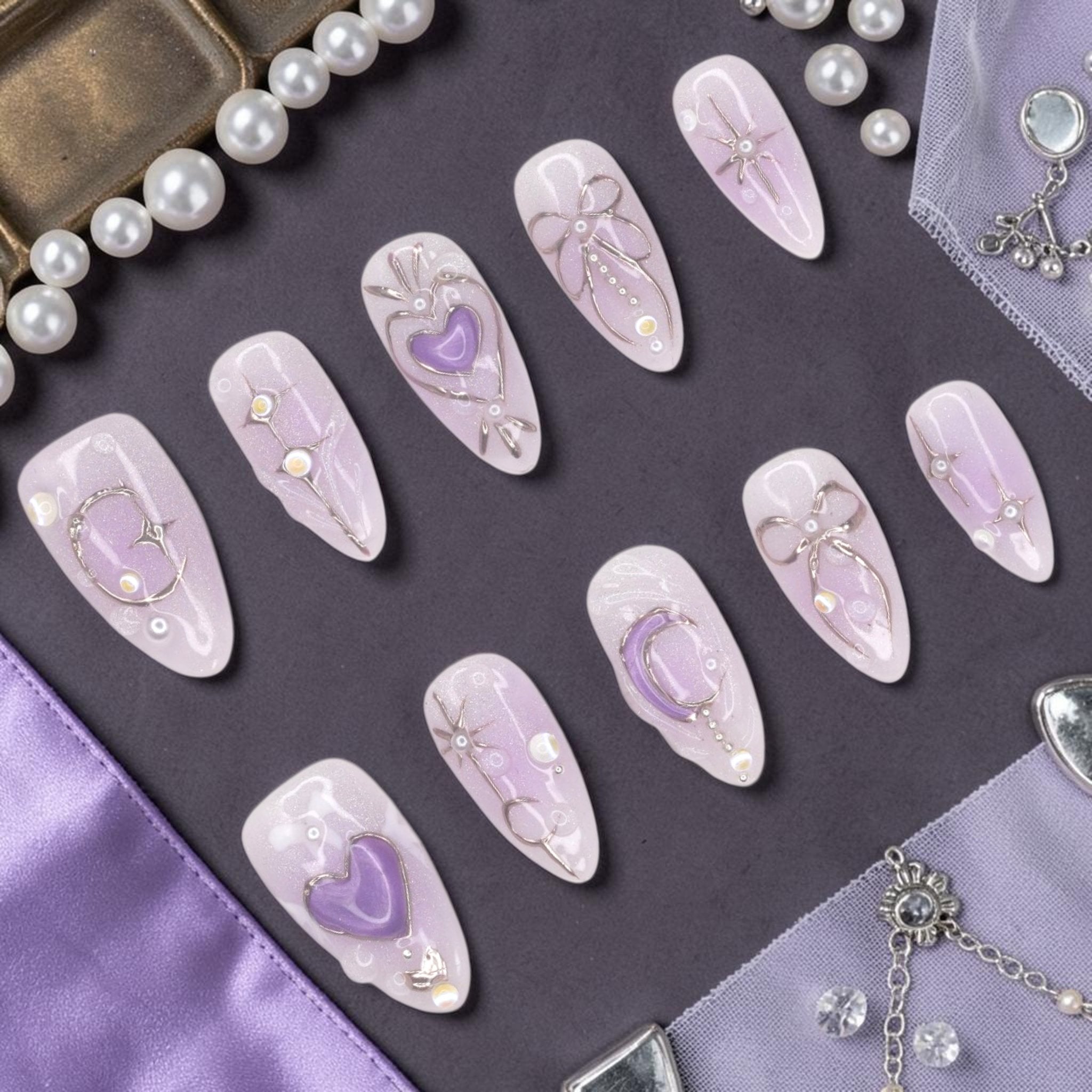 DSC00047 lavender press on nails full set with 3D purple hearts, silver wire bows and moons laid flat