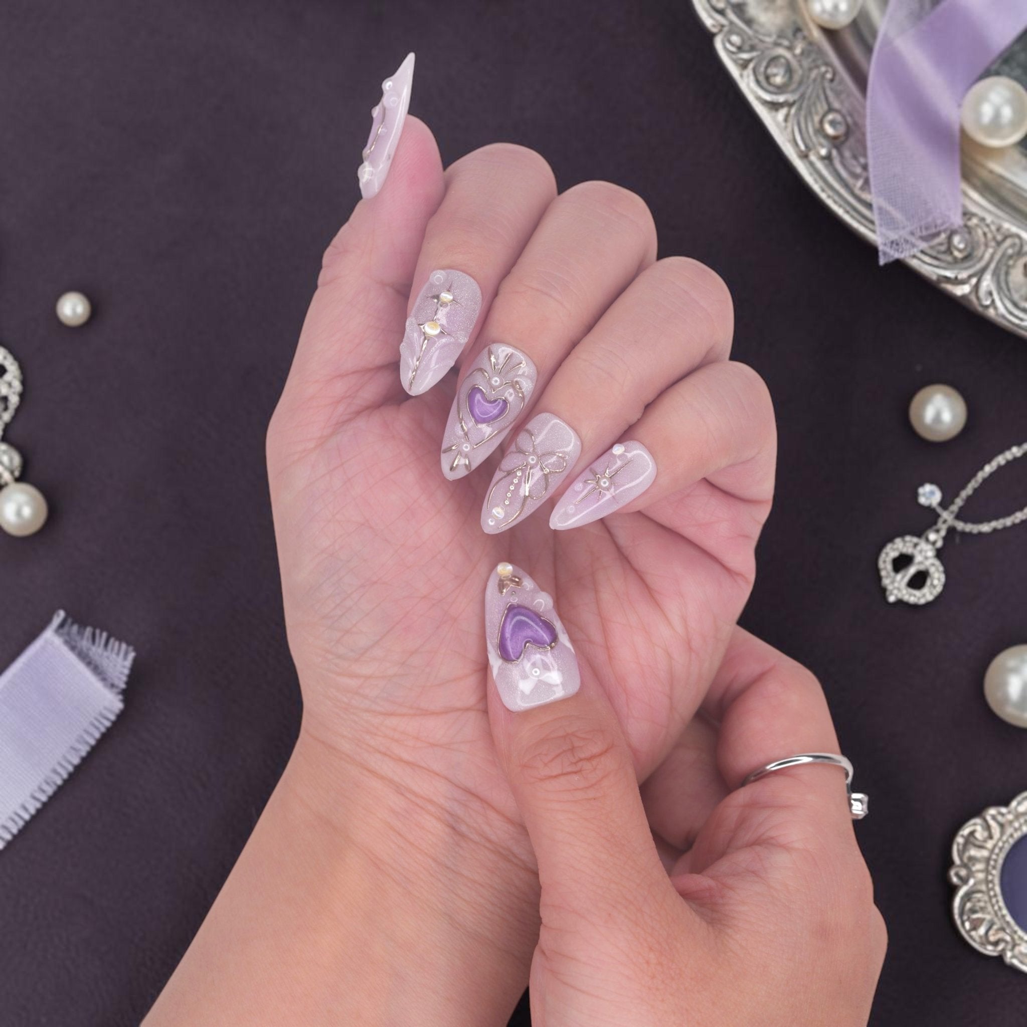 DSC00052 celestial lavender press on nails with silver stars, bows and aurora glow
