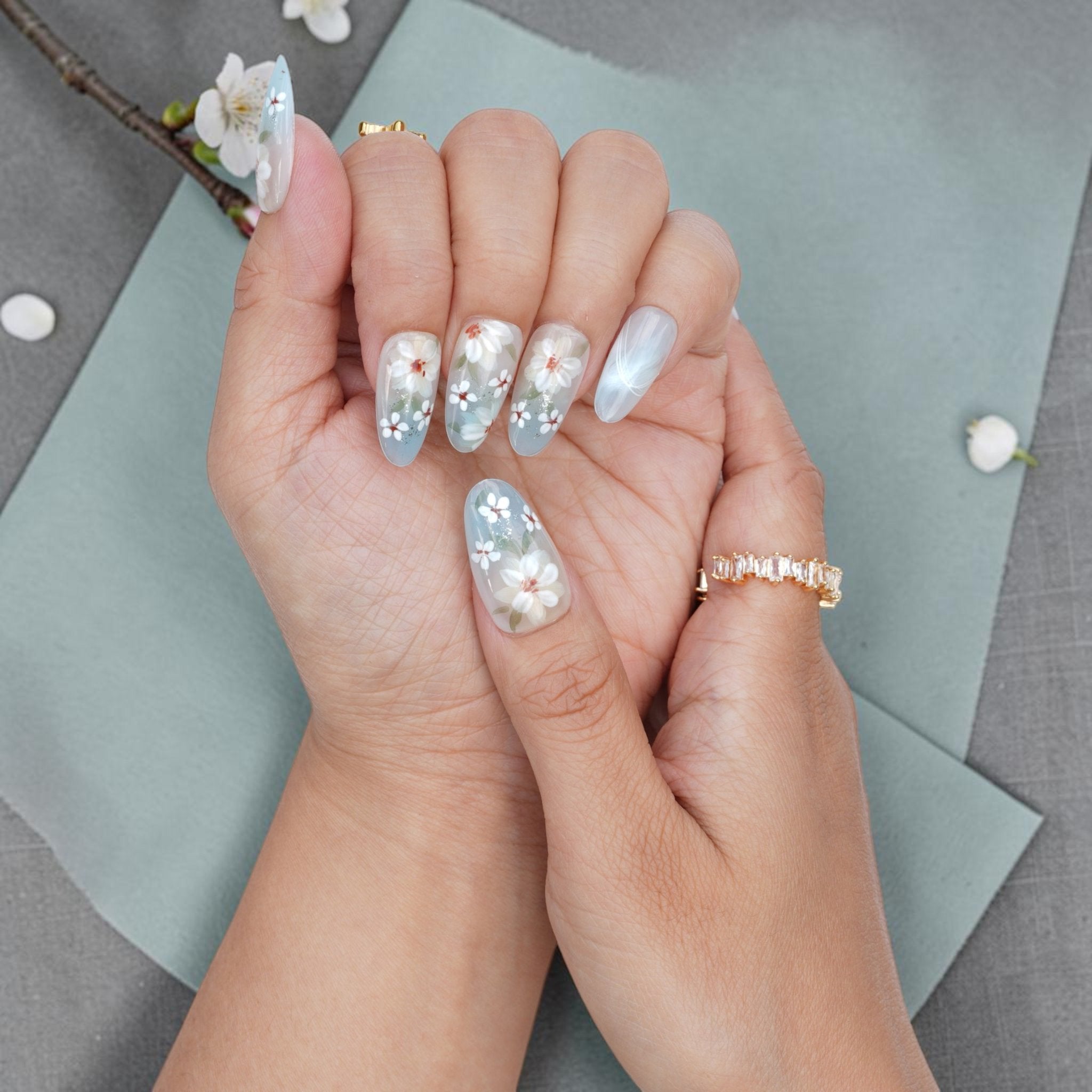 DSC00058 white blossom press on nails held with a cherry blossom branch