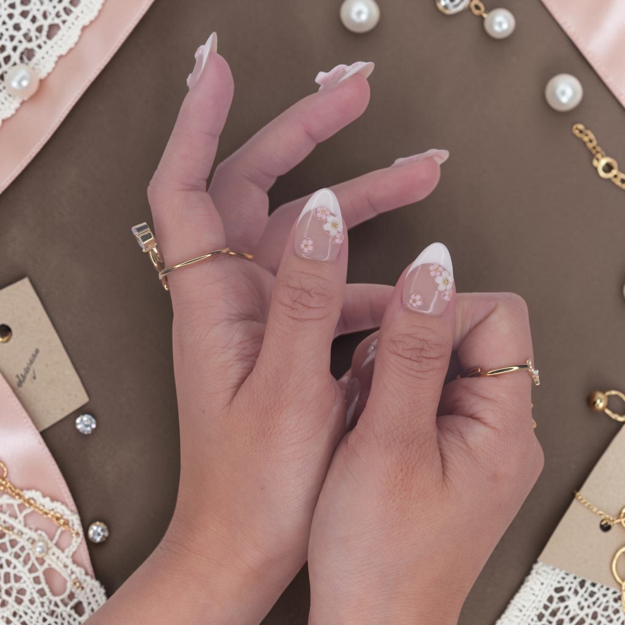 DSC00059 hands wearing bow press on nails with white french tips and 3D flowers