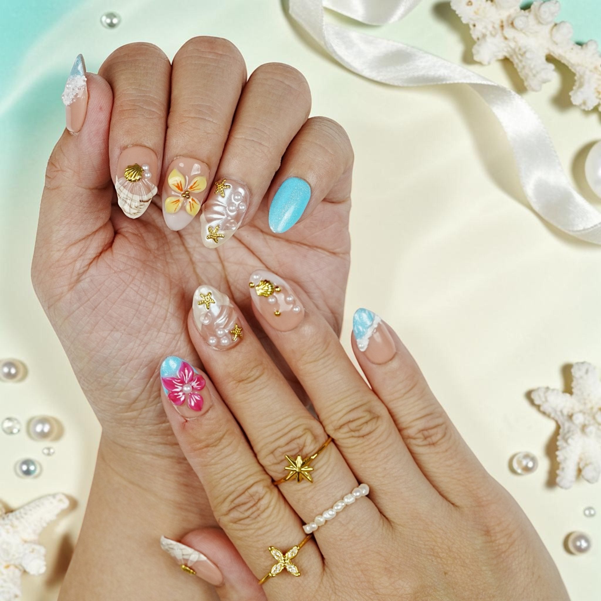 DSC00062 tropical press on nails with 3D seashells, pearls, gold starfish and an aqua cat eye nail