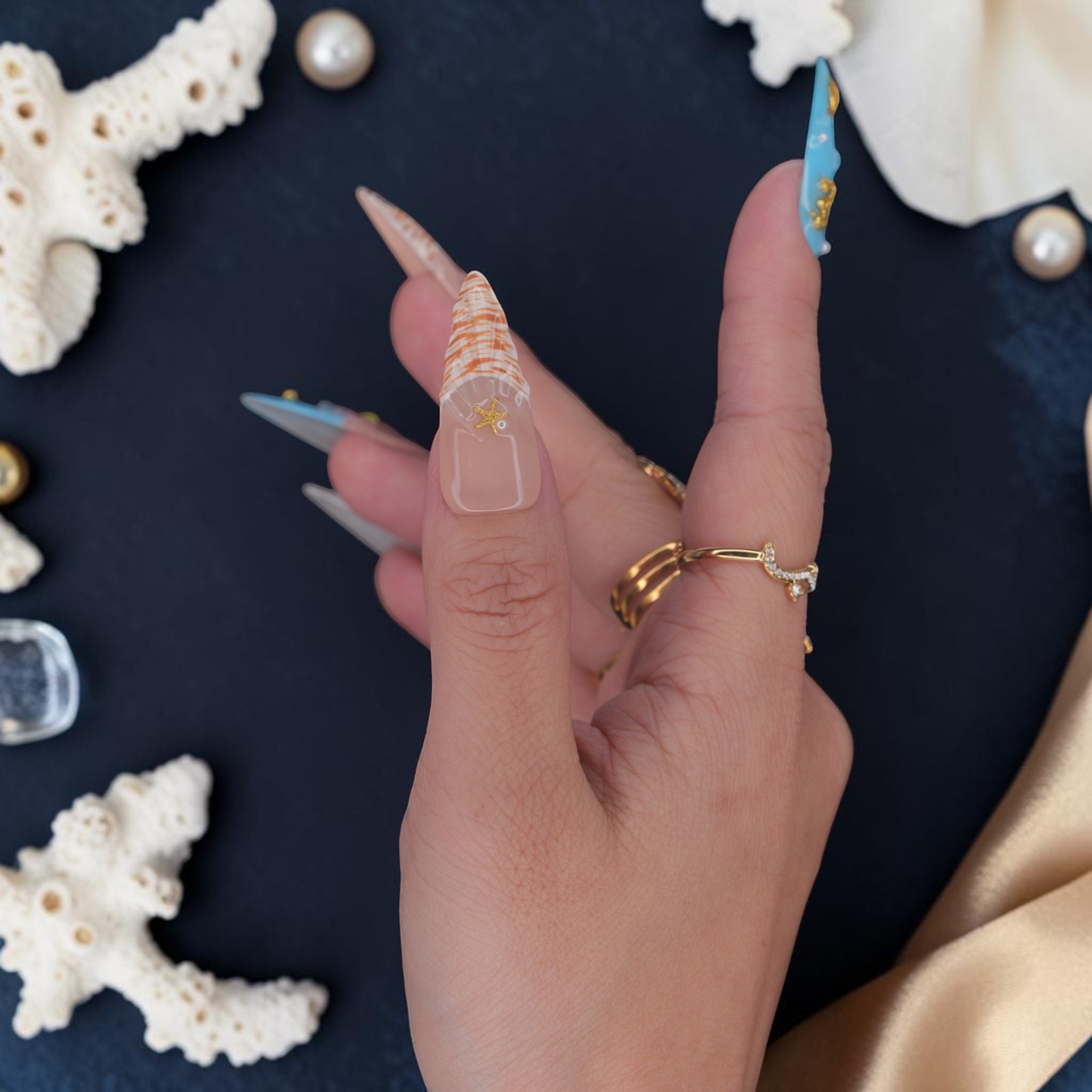 DSC00066 stiletto mermaid press on nail with orange nautilus shell print and gold starfish
