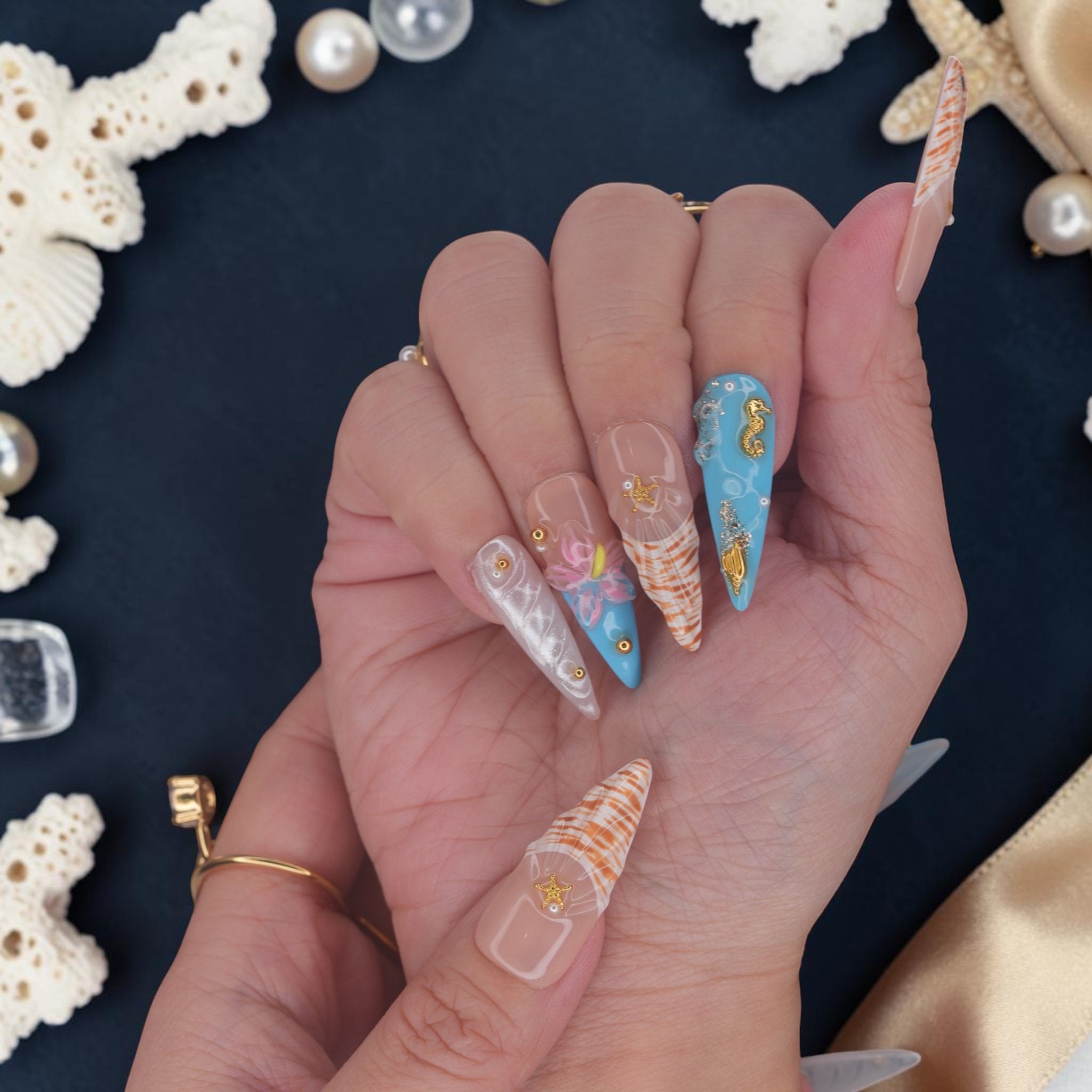 DSC00069 hands wearing mermaid press on nails with 3D pink flowers, shells and seahorse charms