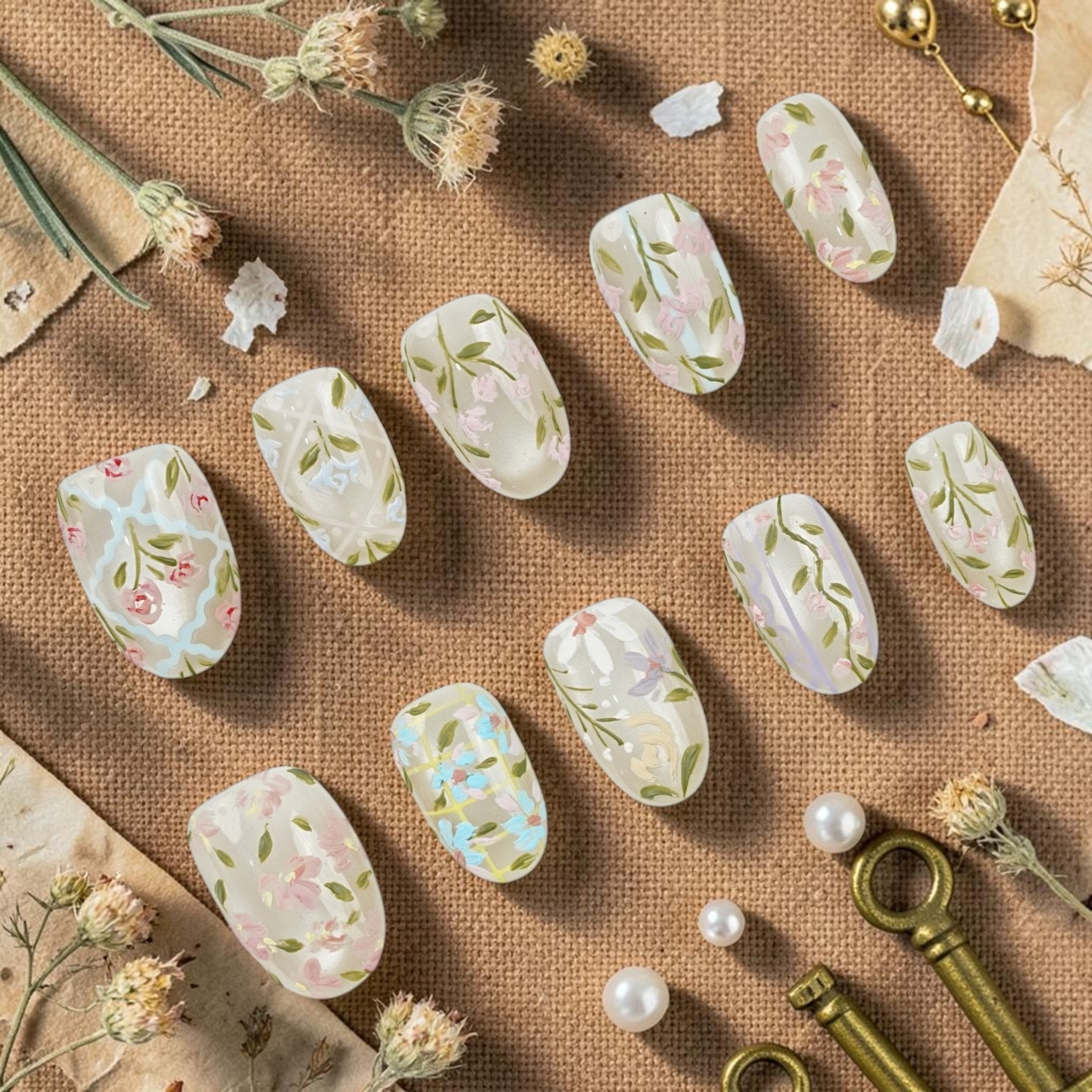 DSC00070 wildflower press on nails full set hand painted with daisies sweet peas and greenery laid flat