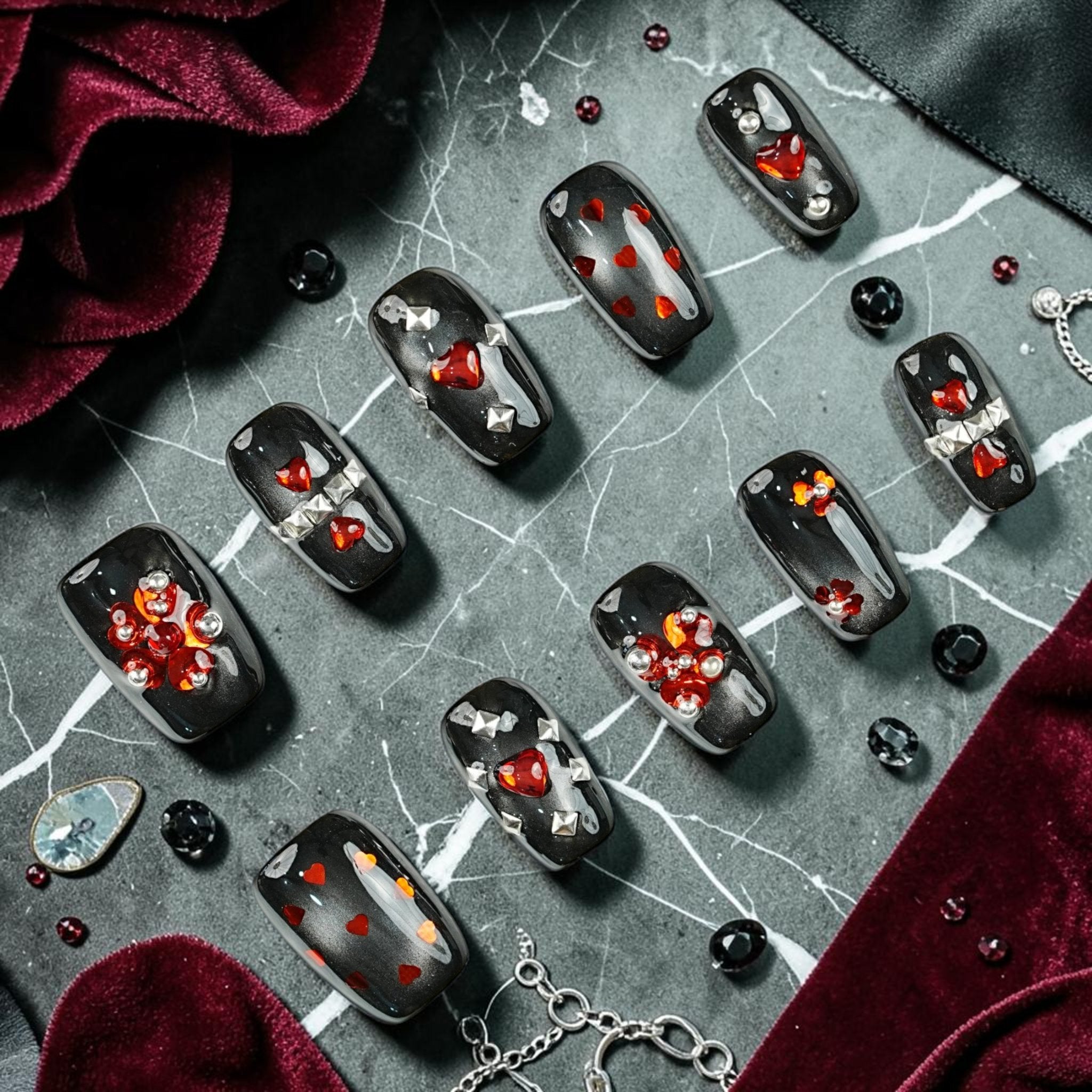 DSC00083 gothic press on nails full set black cat eye with red heart gems silver studs and crystals laid flat