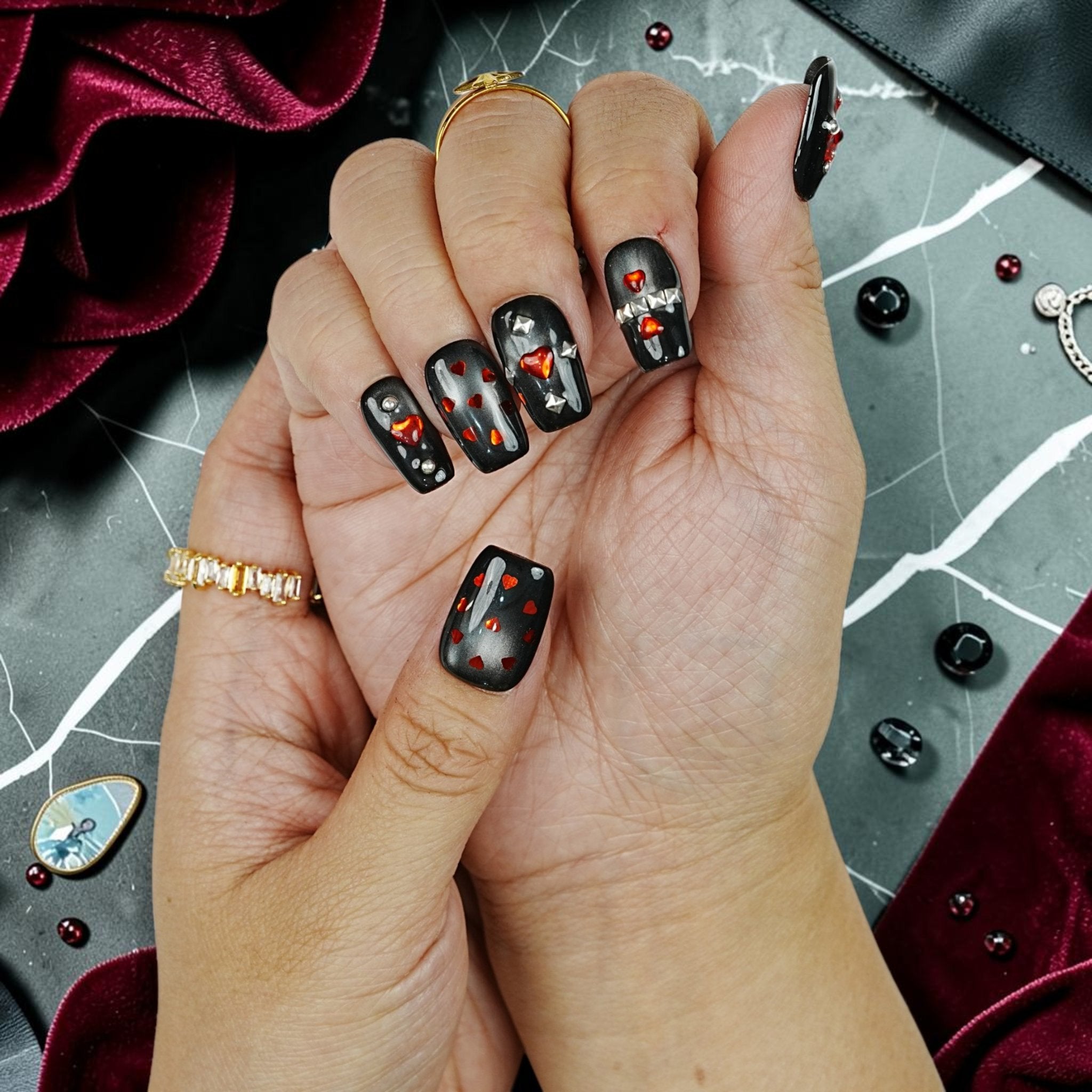 DSC00087 close up of black cat eye gothic press on nails with red hearts