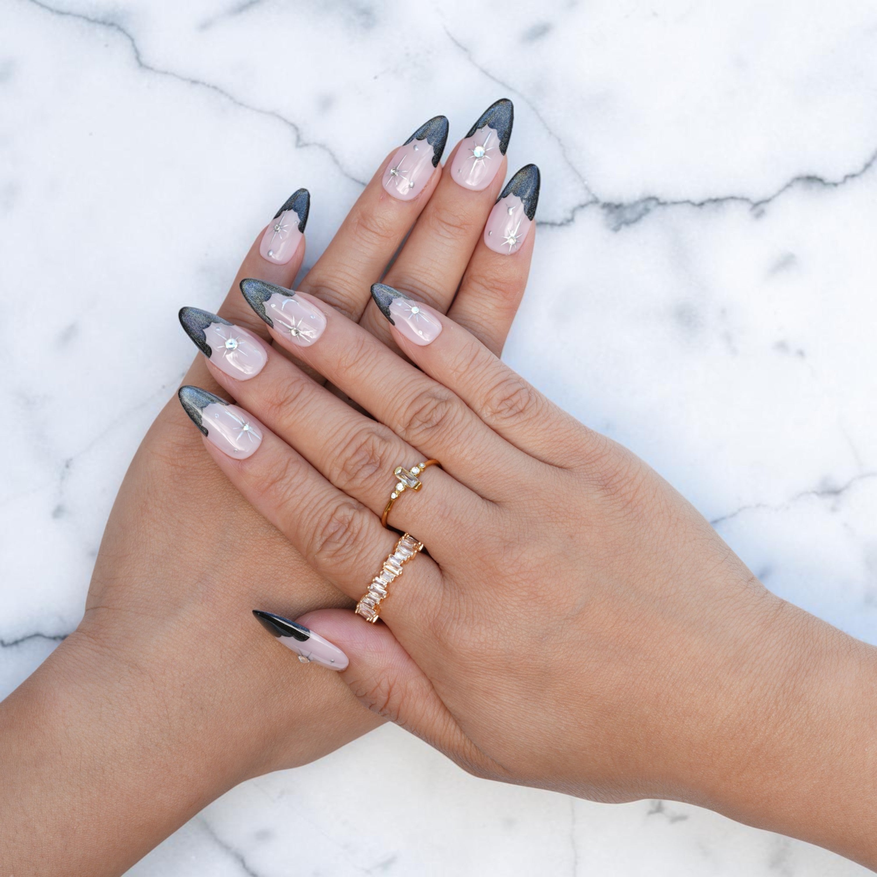 Almond press on nails with smoky cat eye French tips and silver star art