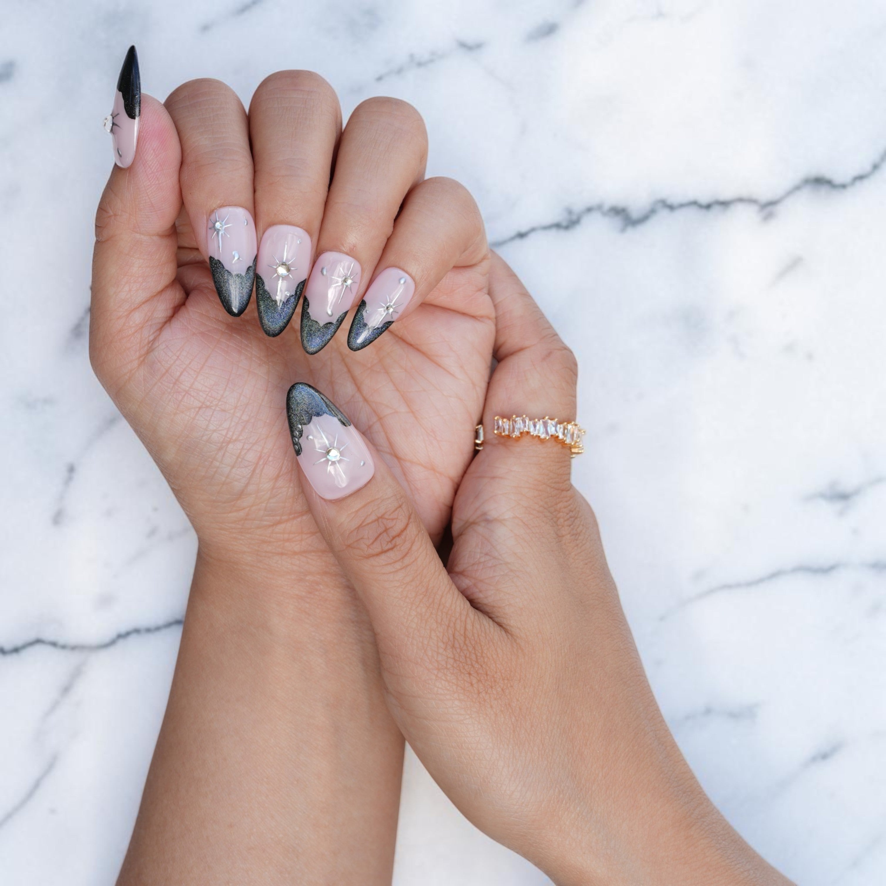 Dark cat eye French tip press on nails with a star burst and caviar beads