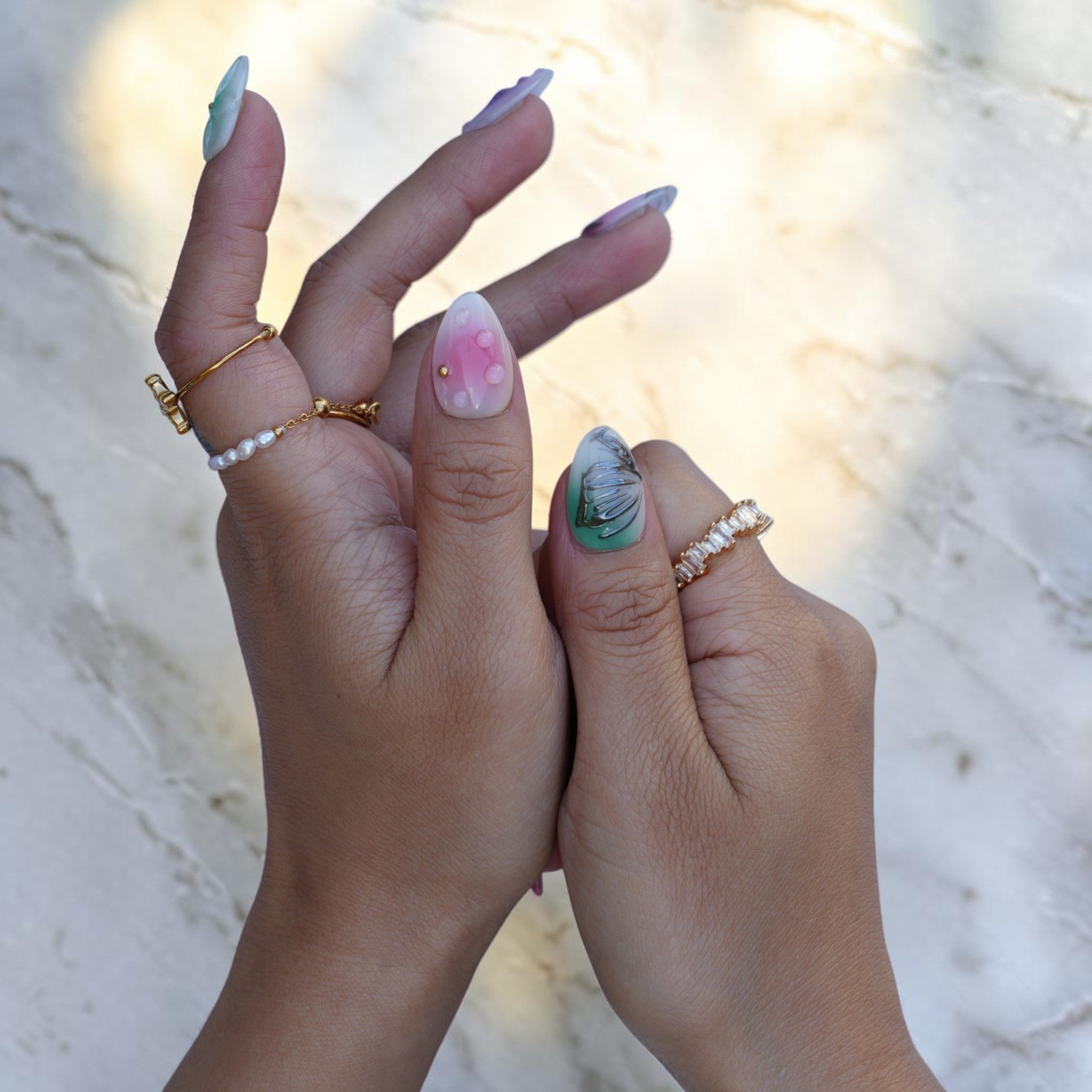 Dreamy pastel almond nails with iridescent shimmer and 3D dewdrops