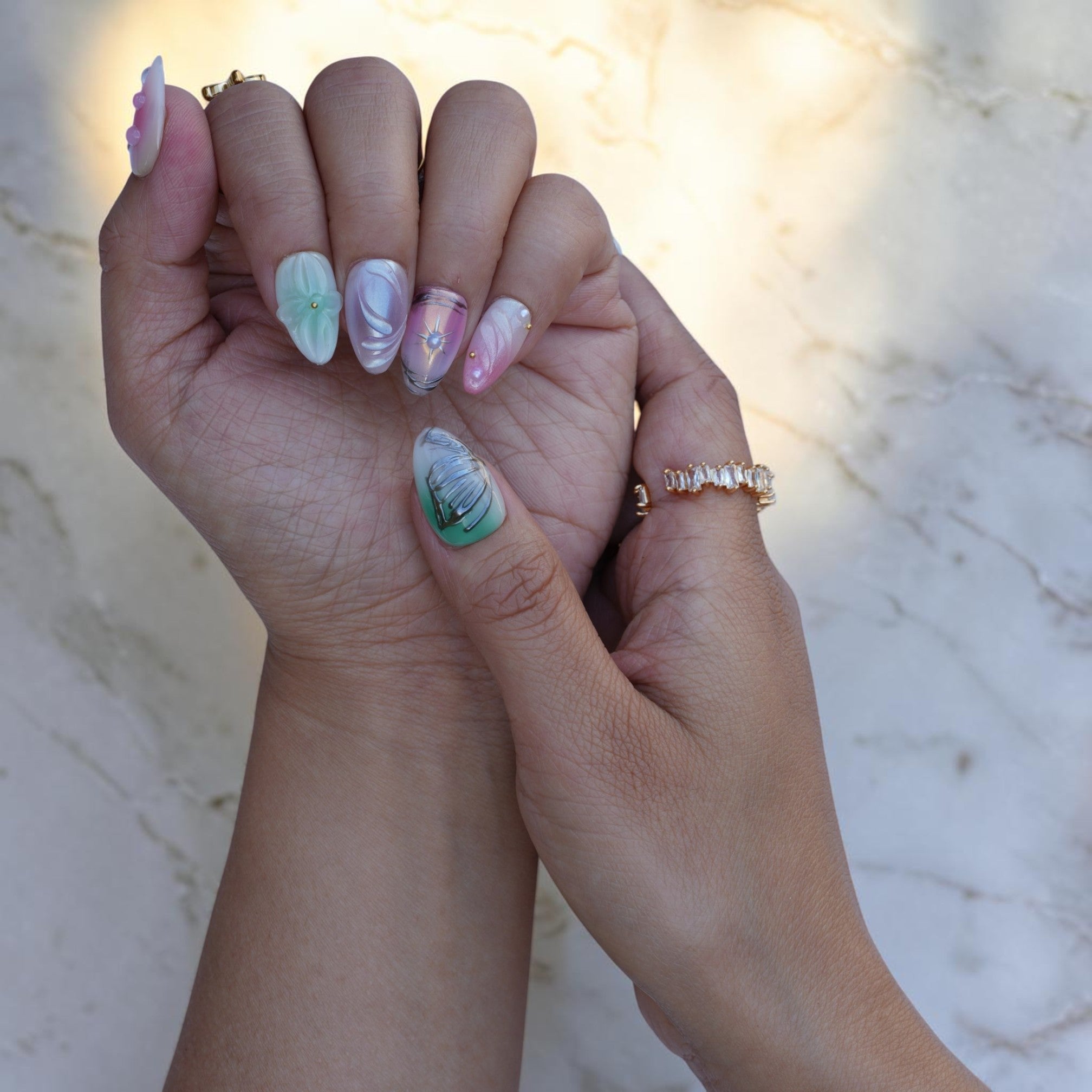 Pastel nails with a celestial star accent and pearly shimmer
