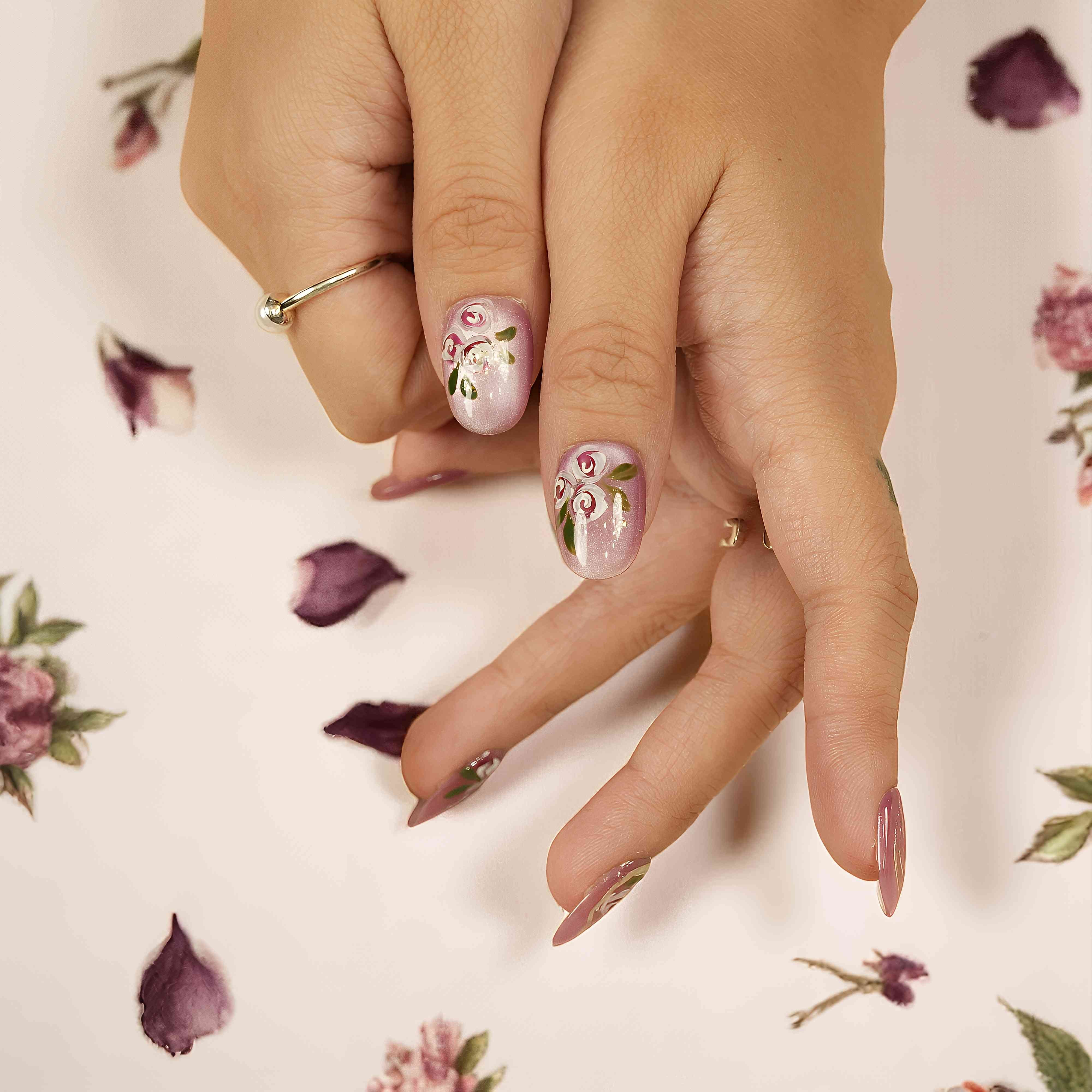 Cat’s eye shimmer press on nails with rose detail on hand – floral nail set Australia