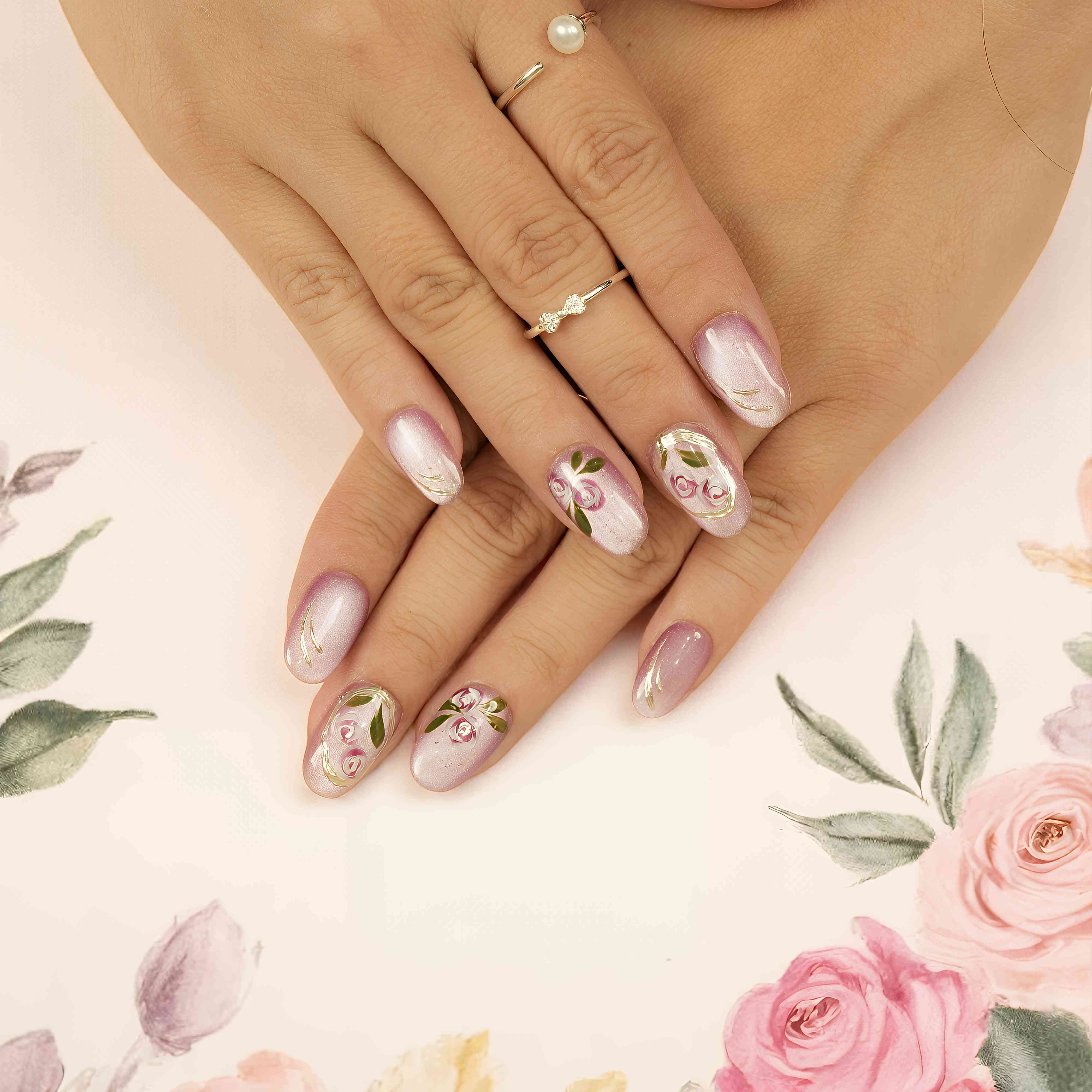 Rose-themed press on nails featuring gold accents, cat’s eye effect, and soft floral elegance