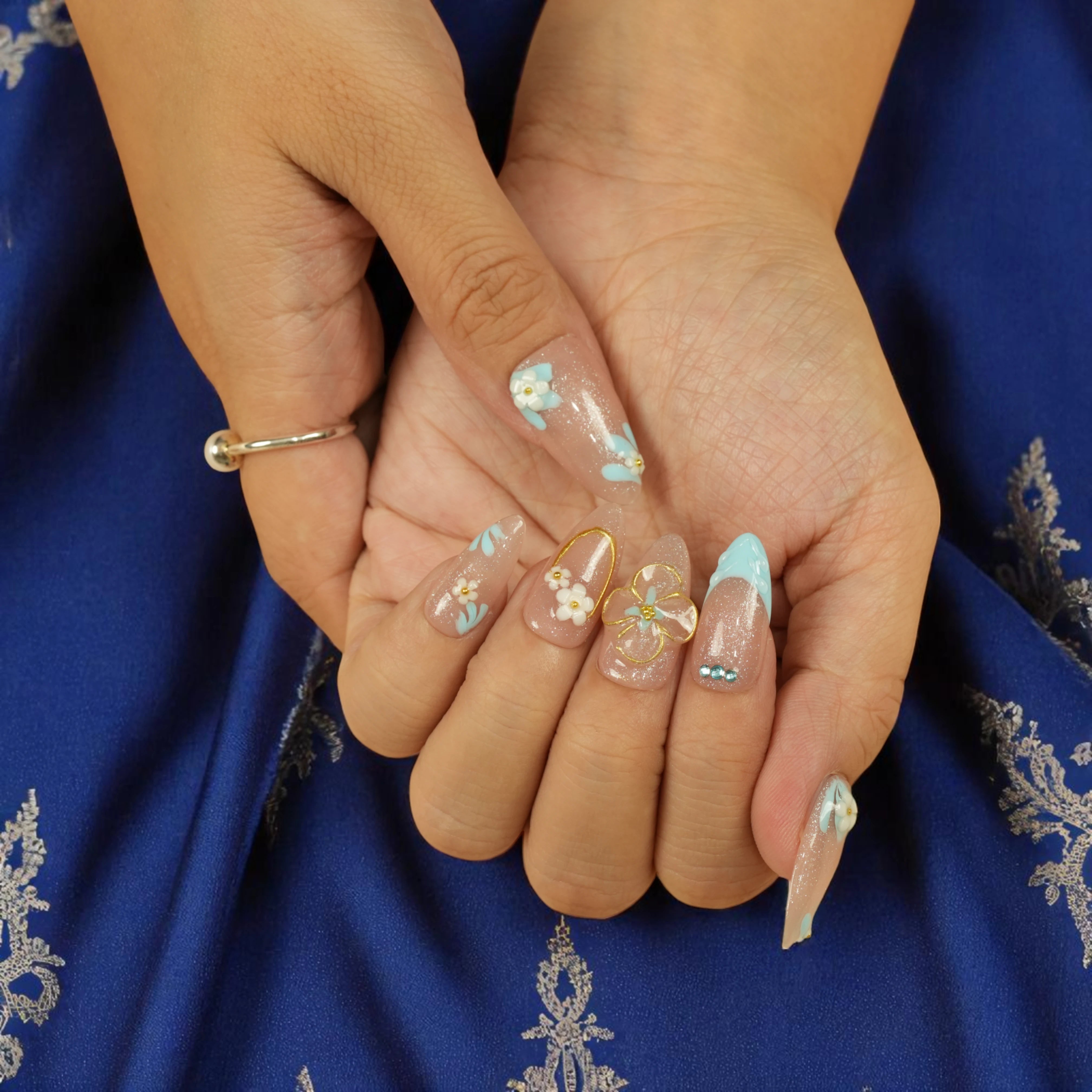 Close-up of floral French stick on nails with shimmer and pearl detail – Bluebell Bloom