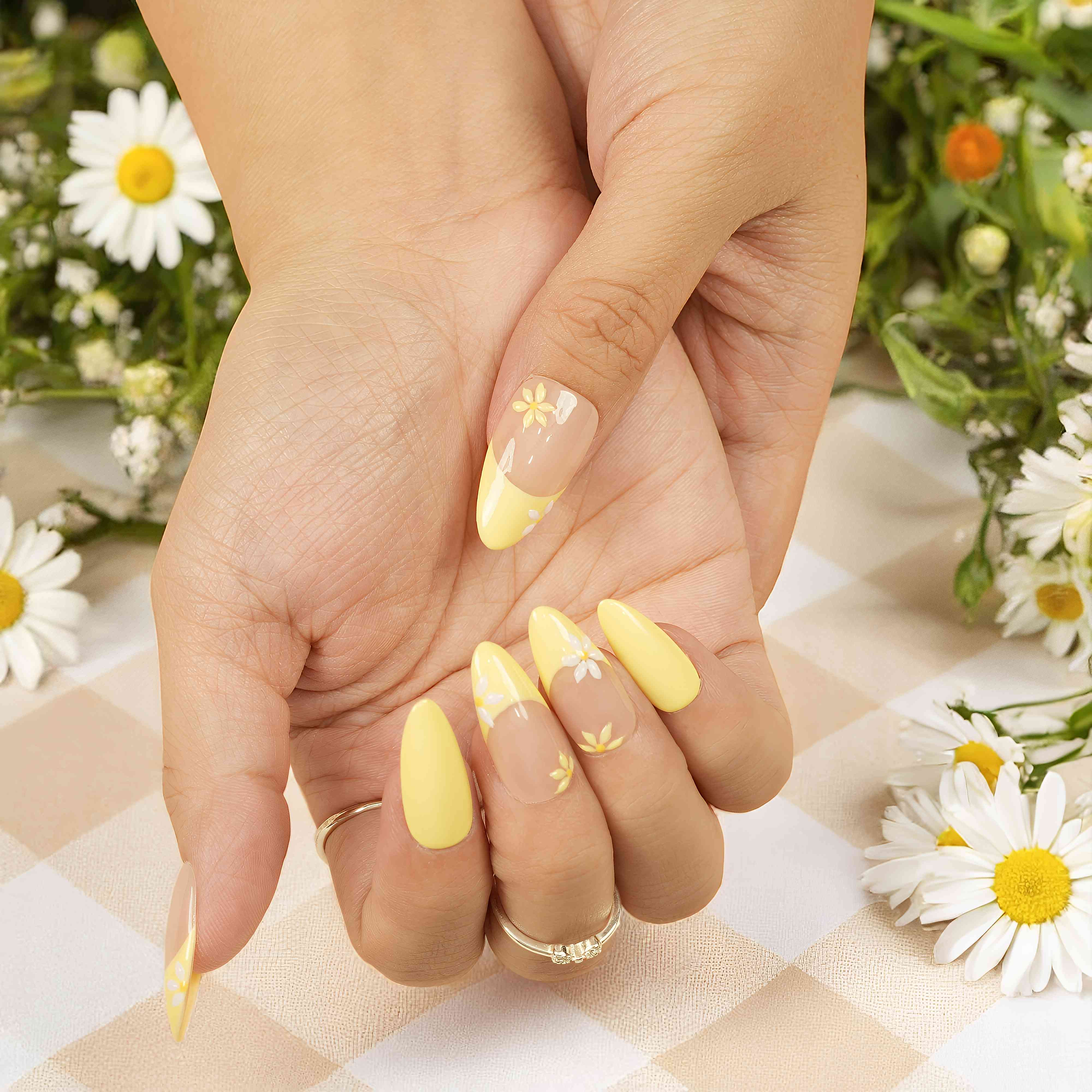 Stick on nails Australia with daisy flowers on nude and yellow base.
