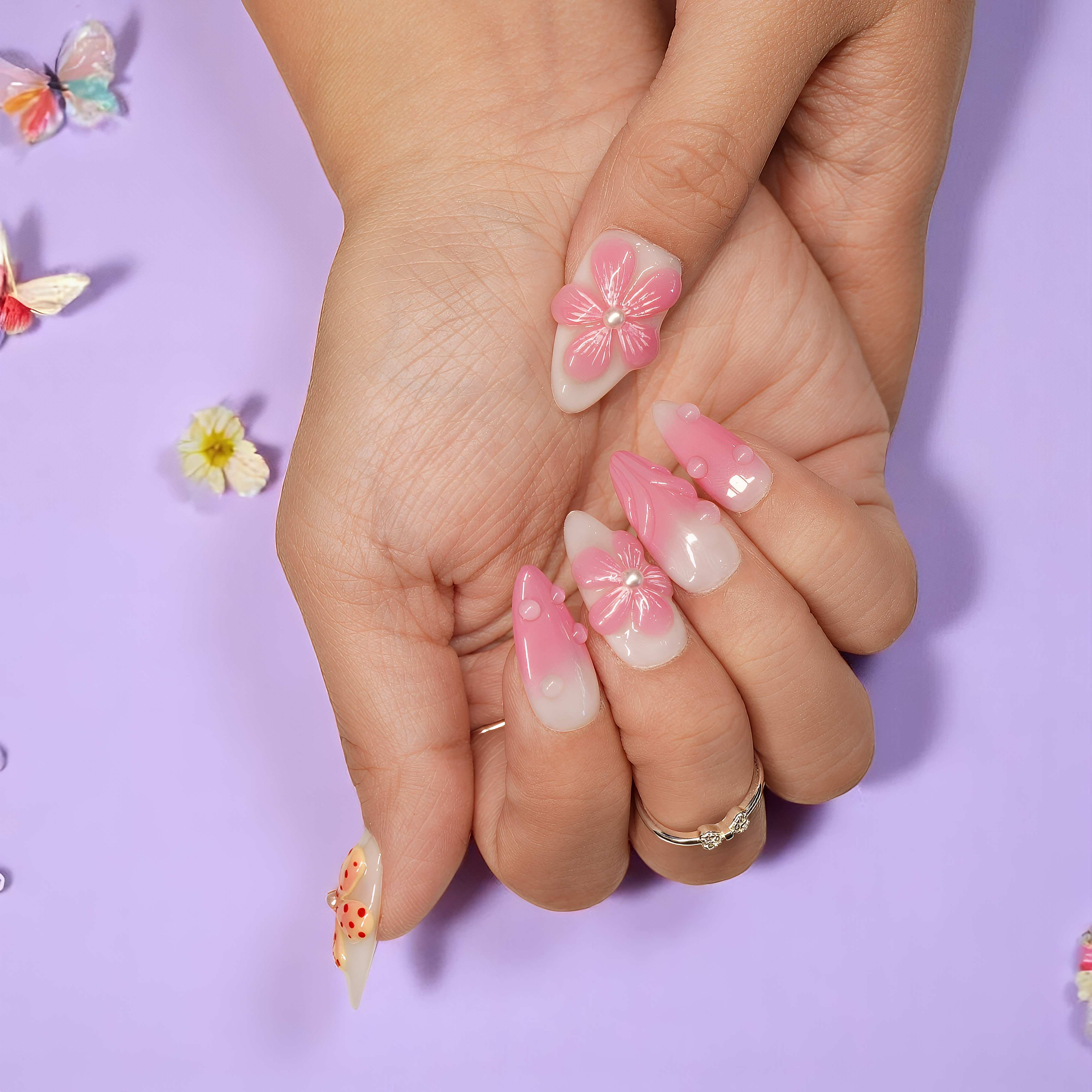 Petal Pop handmade stick on nails in a soft pink gradient with pearl-centered 3D flowers and dewdrop details