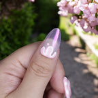 Iridescent pink press on nail with white drip design – glossy fake nail set for cute spring looks in Australia