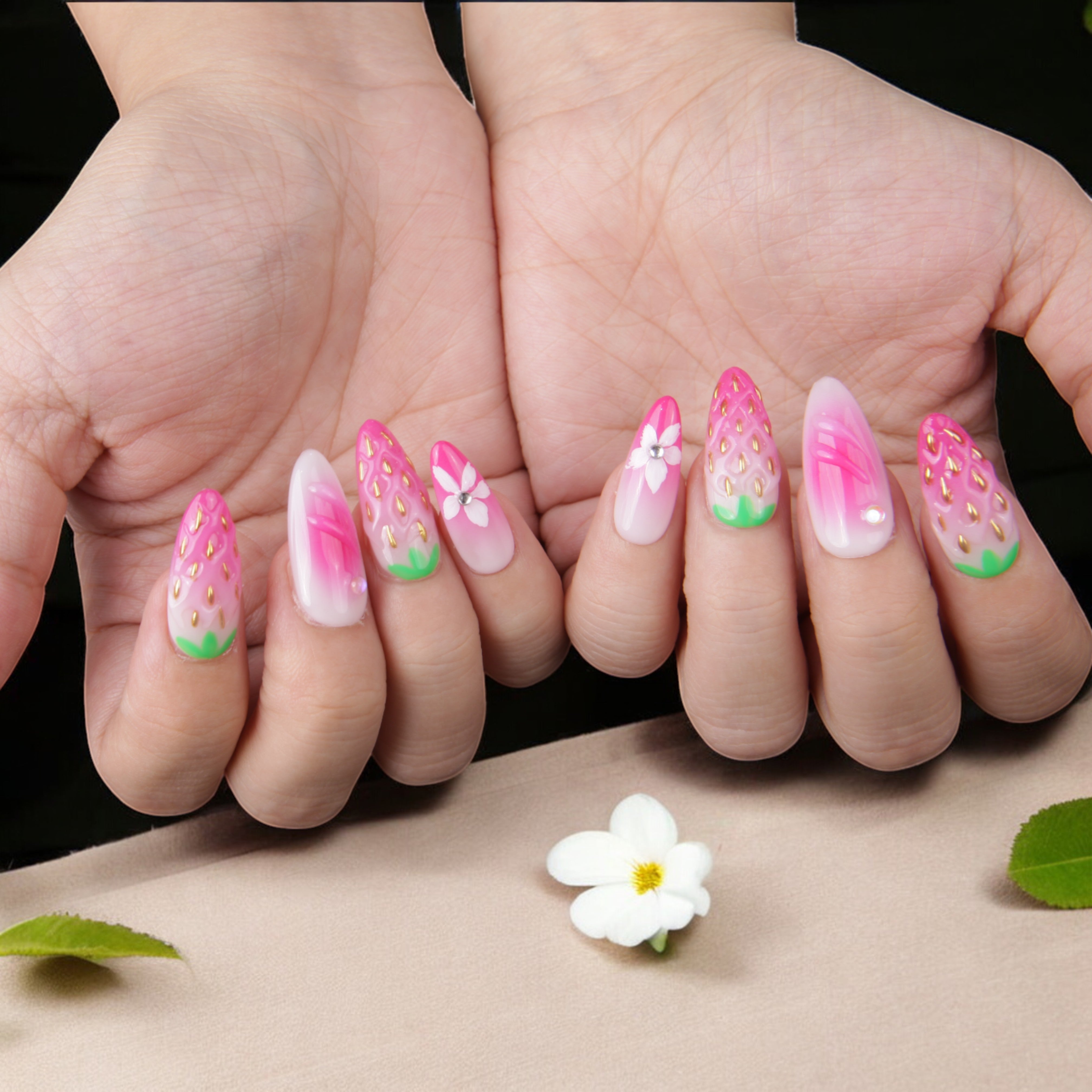 thumb view of juicy strawberry-themed artificial nails with a glossy finish, adorned with 3D flowers and hand-painted pink berry details