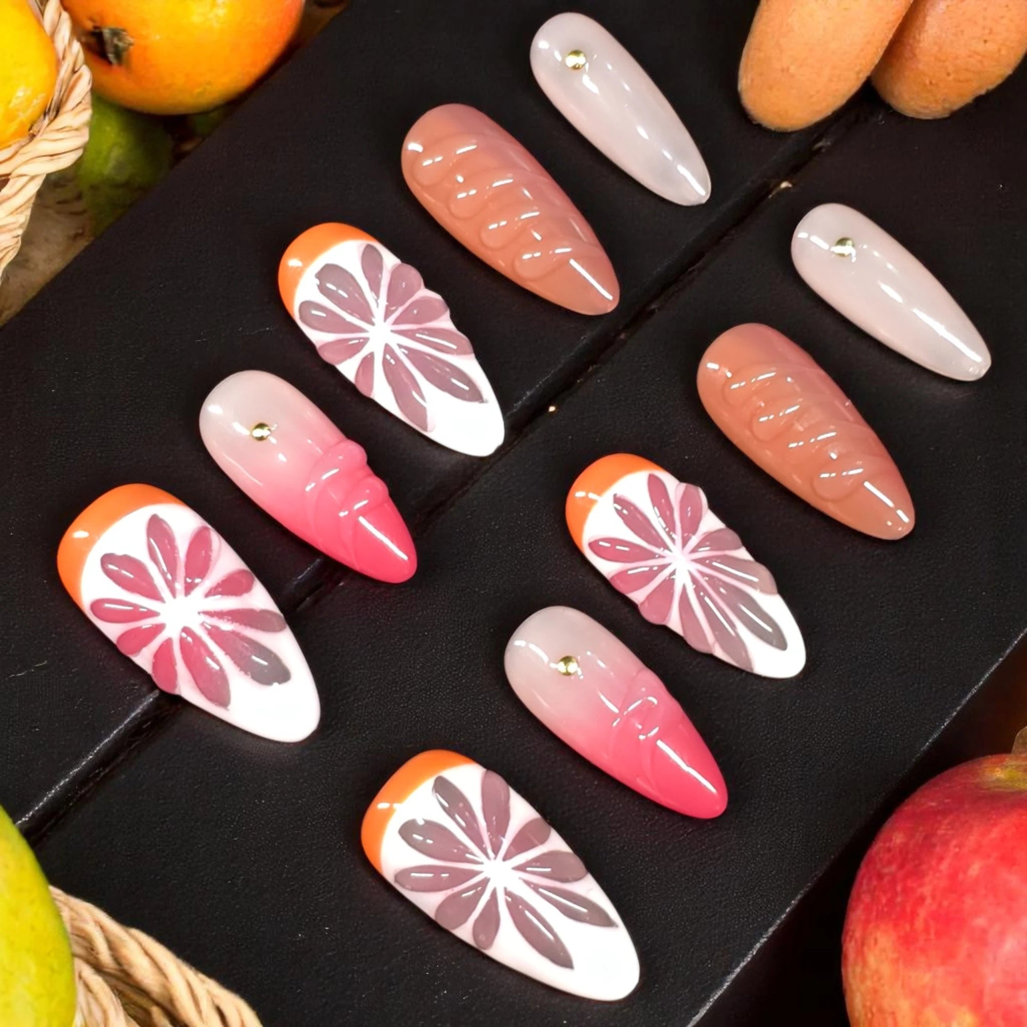 Sunkissed Citrus press on nails with vibrant fruity orange and pink designs, handmade reusable nails Australia