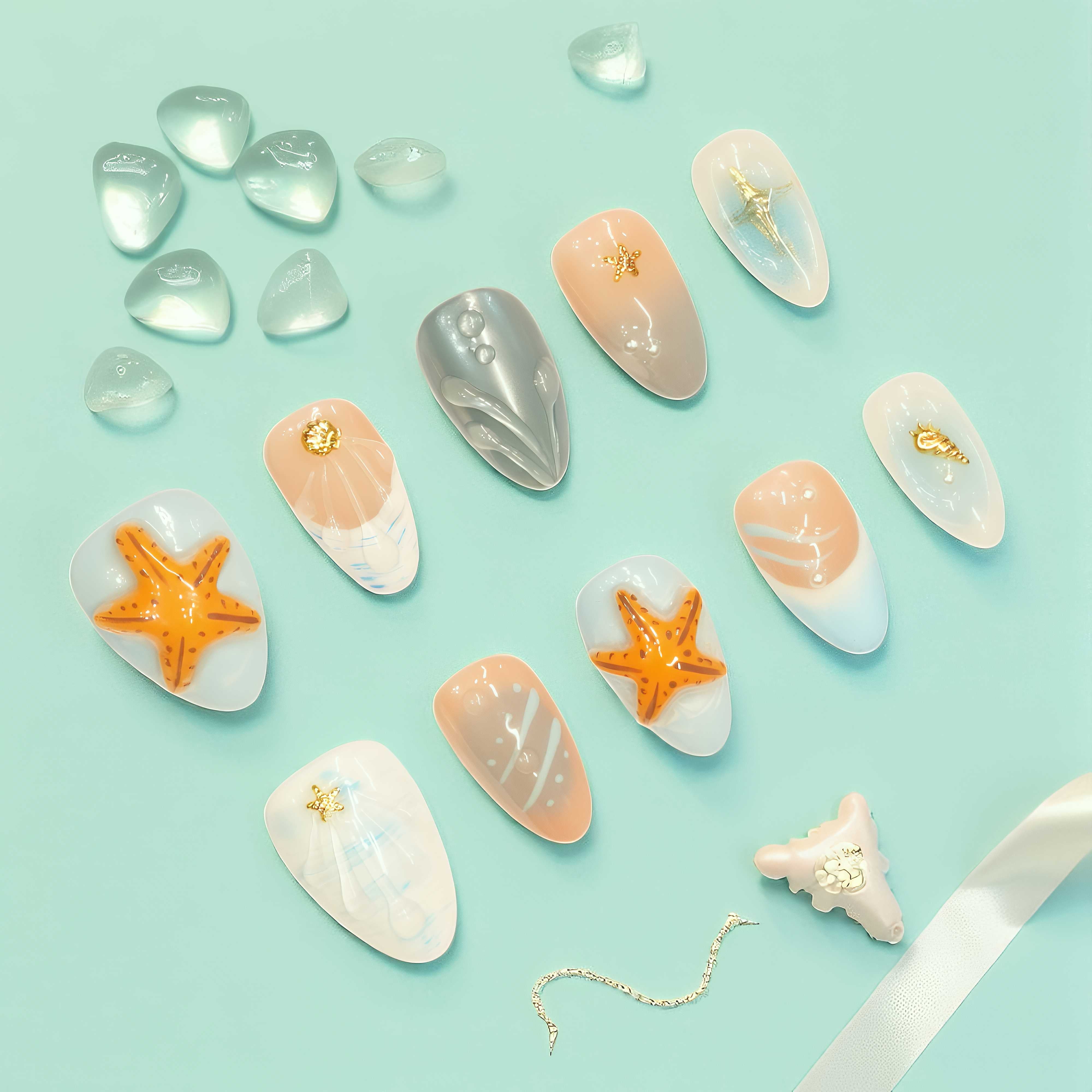 Minimalist summer press on nails with flowing waterlines and seashell textures – easy beach style.