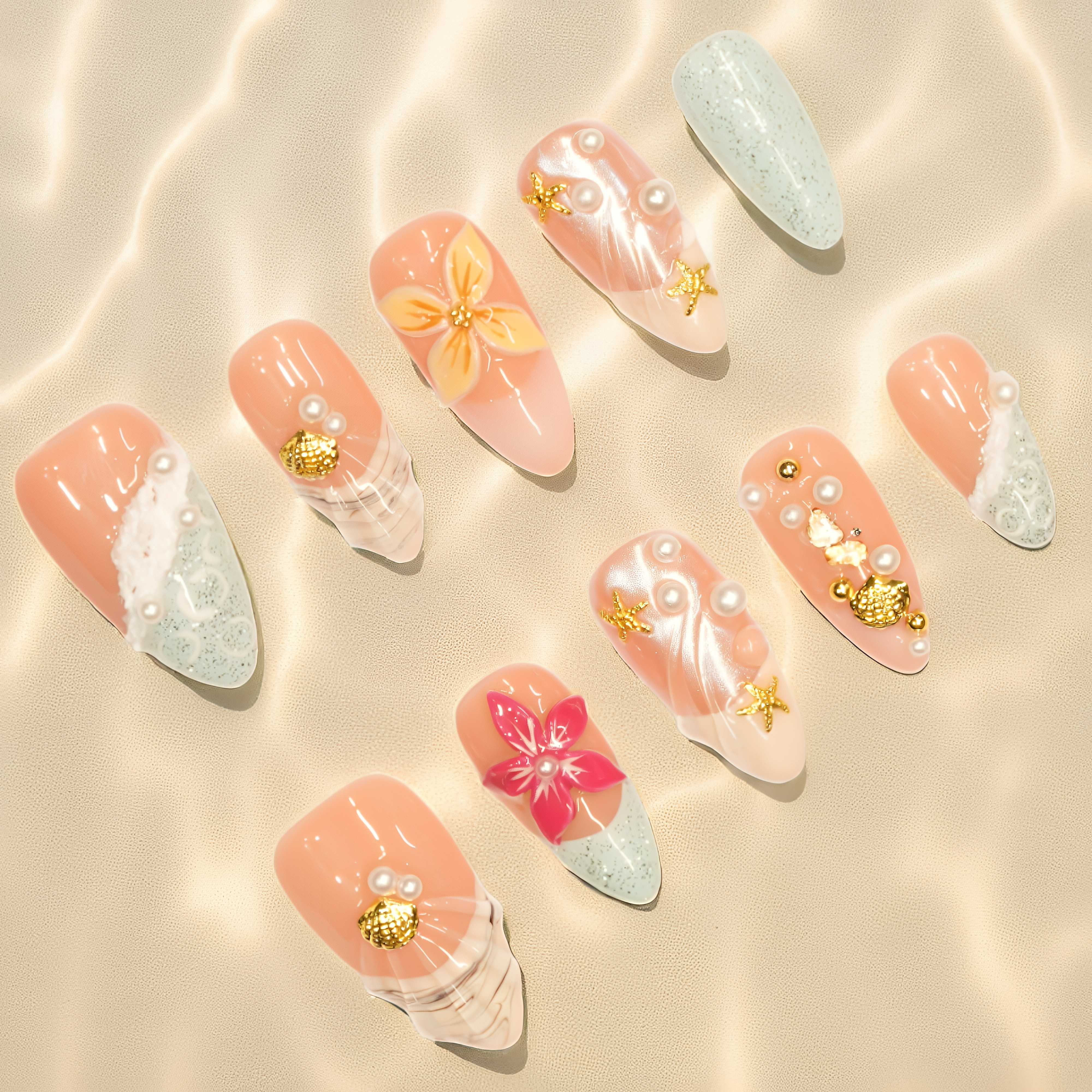Nail press on nails with gold seashell charms and pastel mint tips