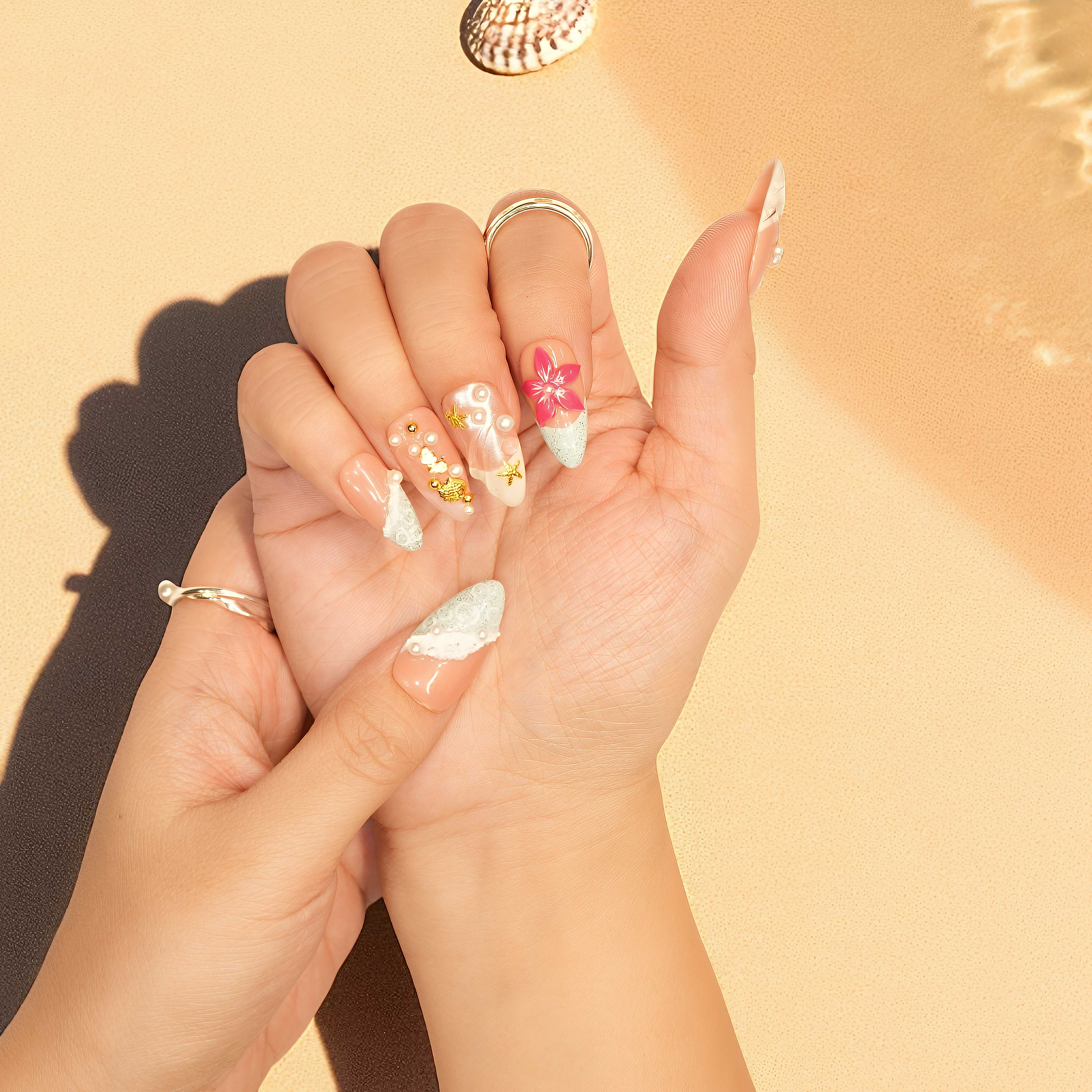 Long almond nail press on nails with tropical design and gold accents