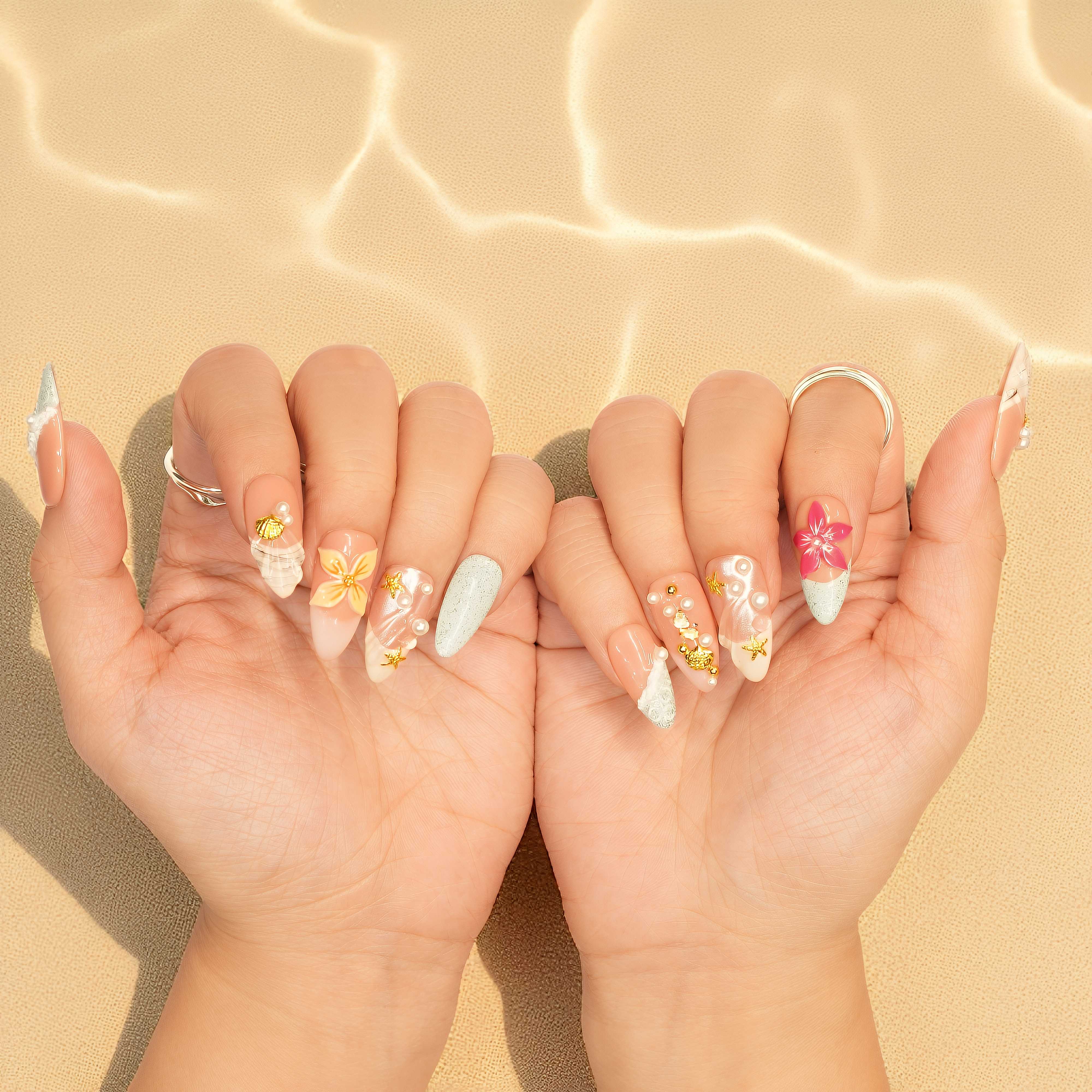 Floral and seashell press on nails with beach-inspired colors