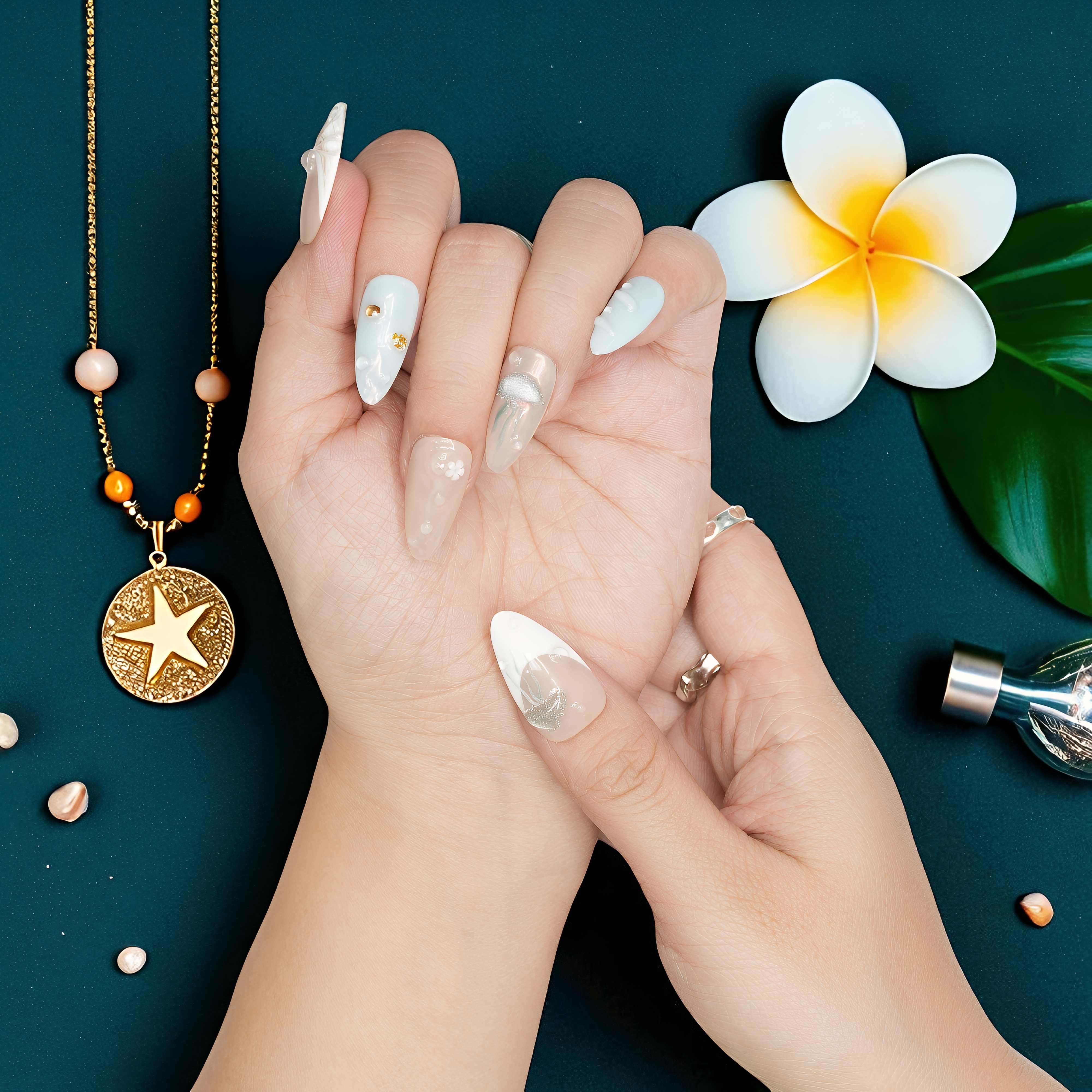 Ocean-inspired press on nail with sculpted blue jellyfish and pearl accents