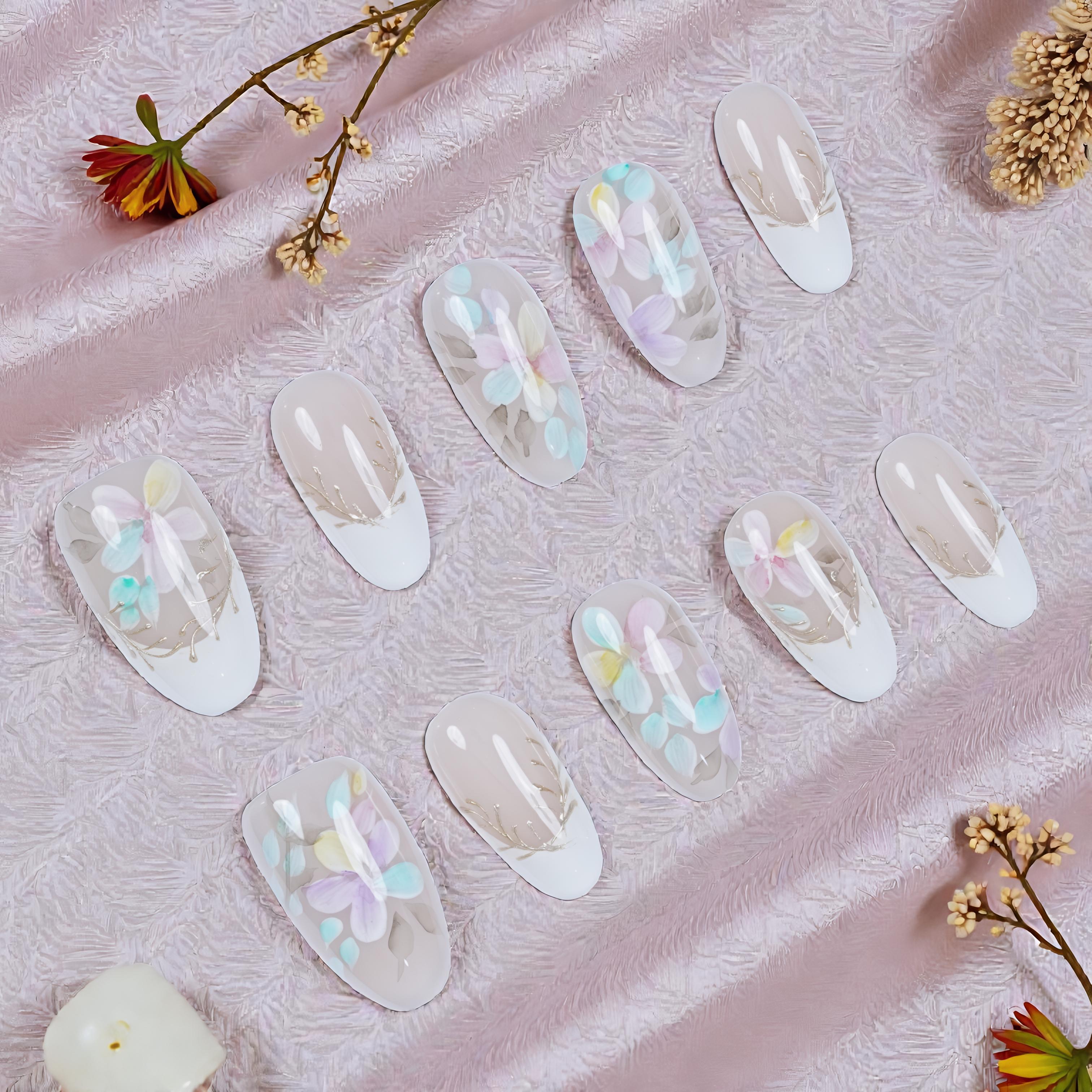 Stick on nails set featuring pastel pink, lilac, and soft blue with floral accents – Blooming Mist design
