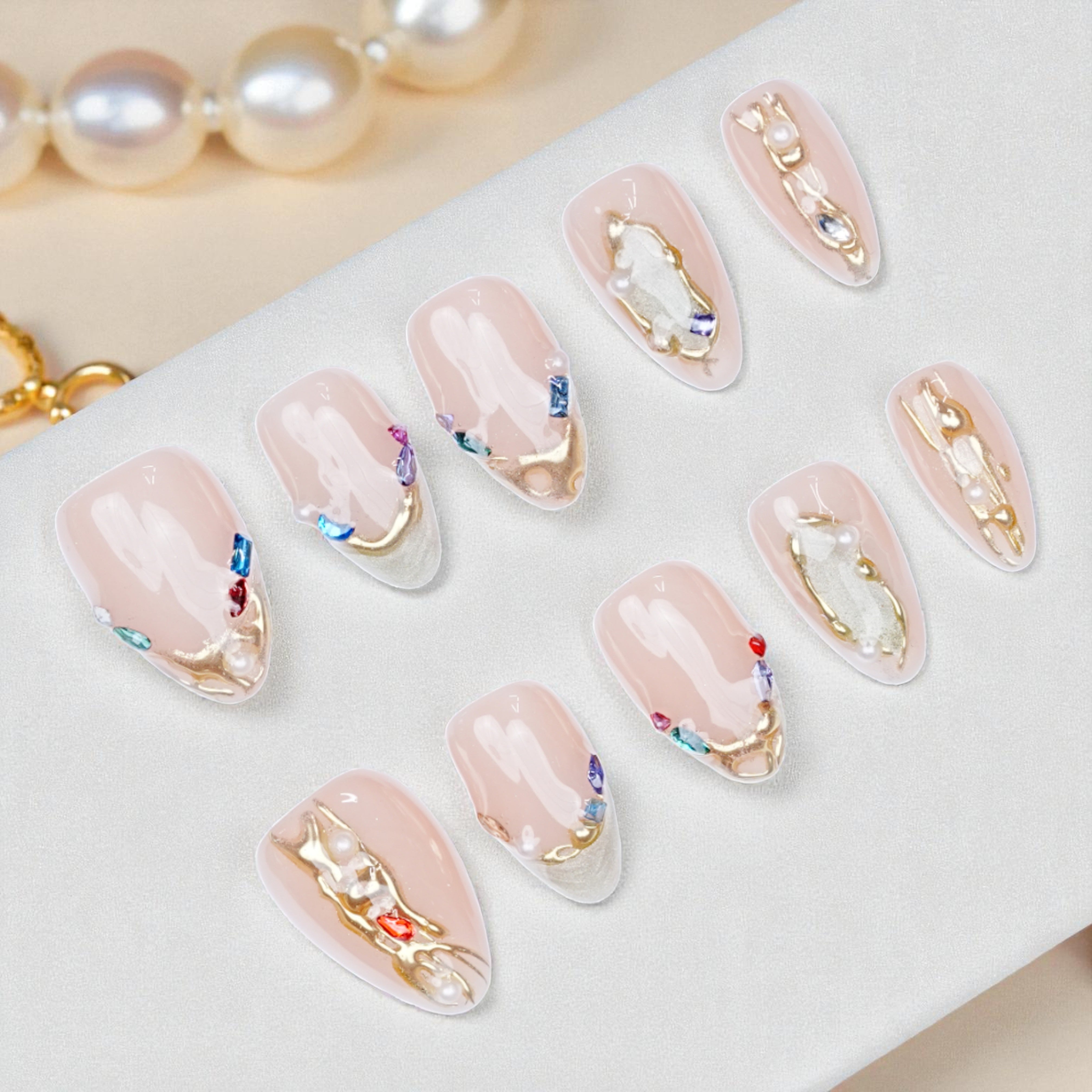 Blush chrome press on nails with floral 3D design displayed in box layout