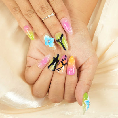 vibrant glue on nails with retro pink, orange, and green patterns and glossy beads