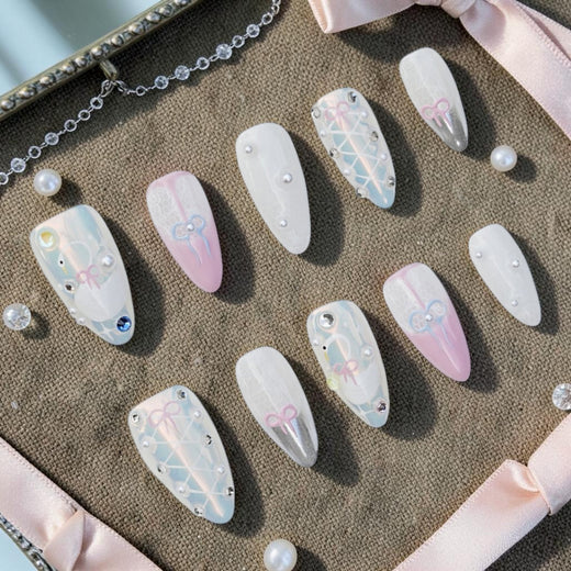 DSC00001 coquette press on nails full set with bows lace pearls and chrome laid in a box