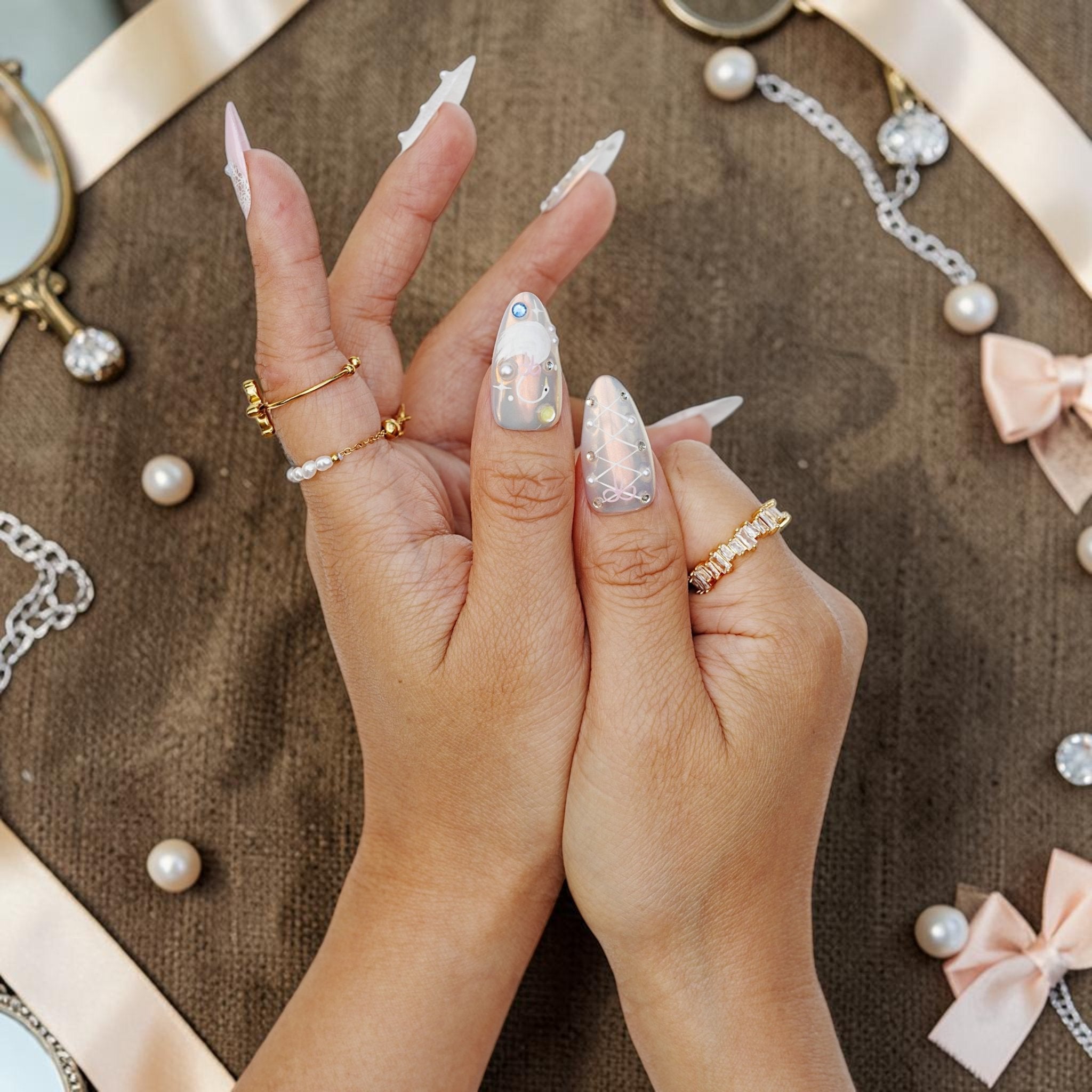 DSC00006 coquette press on nails with bows lace and chrome held in two hands