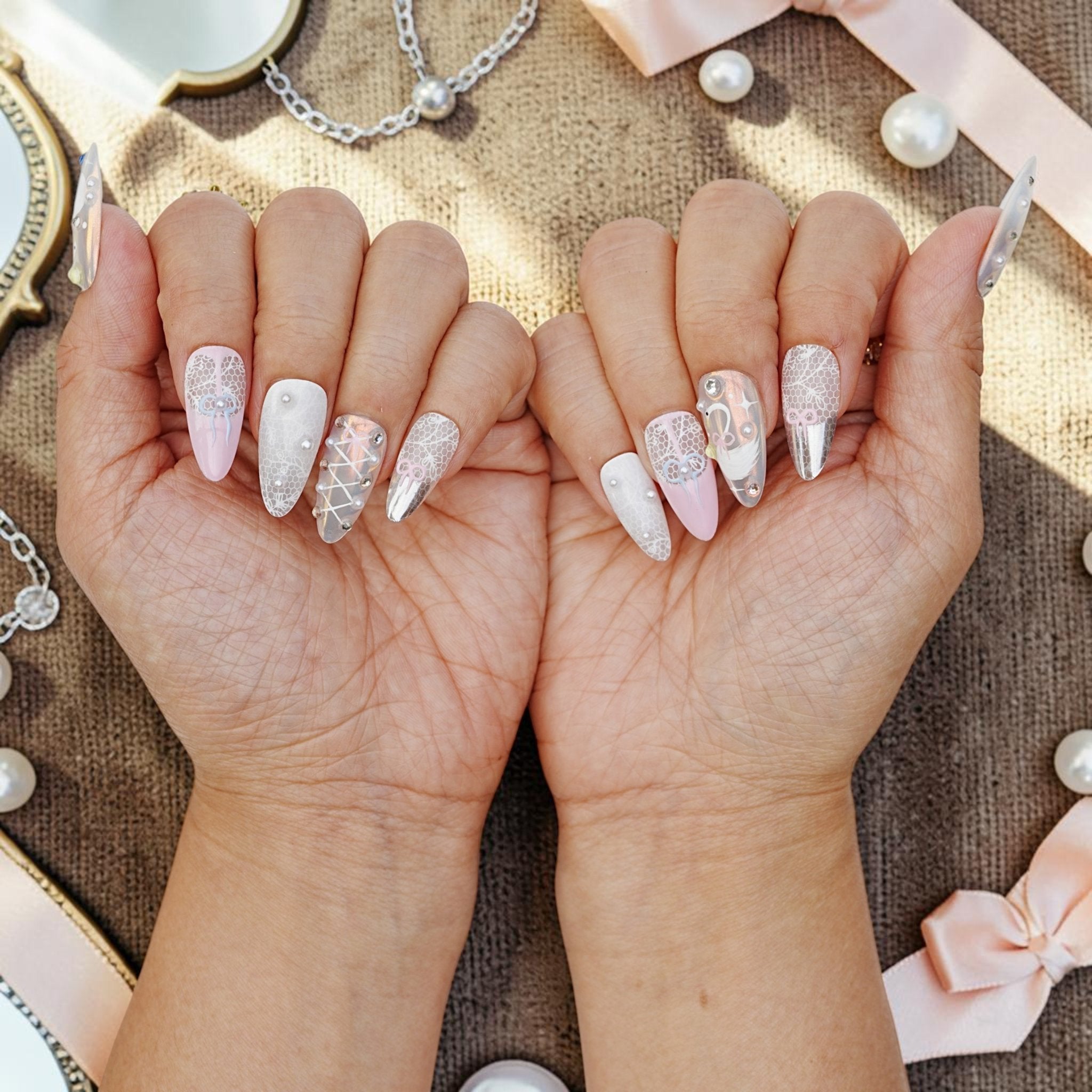 DSC00007 pair of hands showing coquette bow and lace press on nails