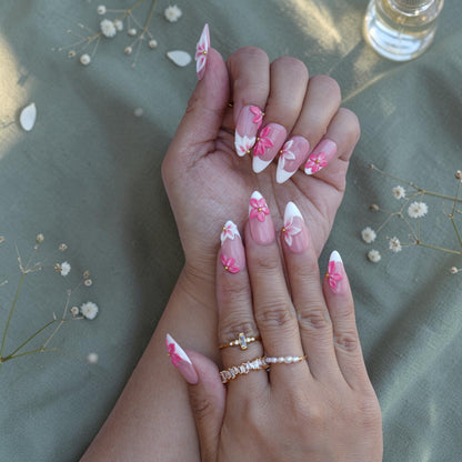 Pink and white 3D flower press on nails in a long almond shape