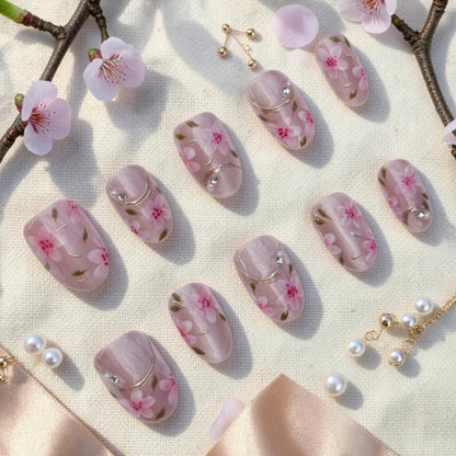 DSC00011 sakura press on nails full set with pink cherry blossoms and gold lines laid flat