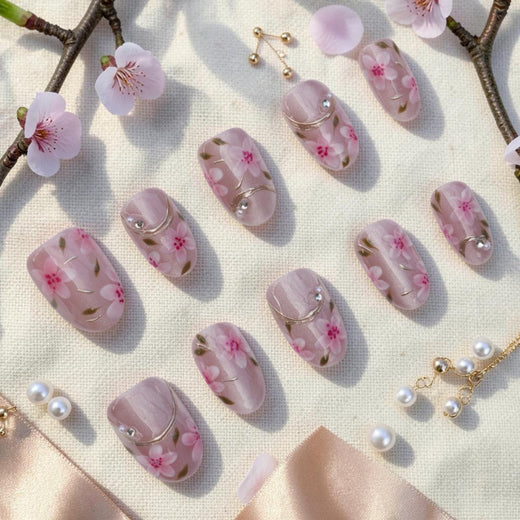 DSC00011 sakura press on nails full set with pink cherry blossoms and gold lines laid flat