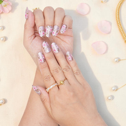 DSC00013 close up of pink sakura blossoms and gold lines on pearly press on nails