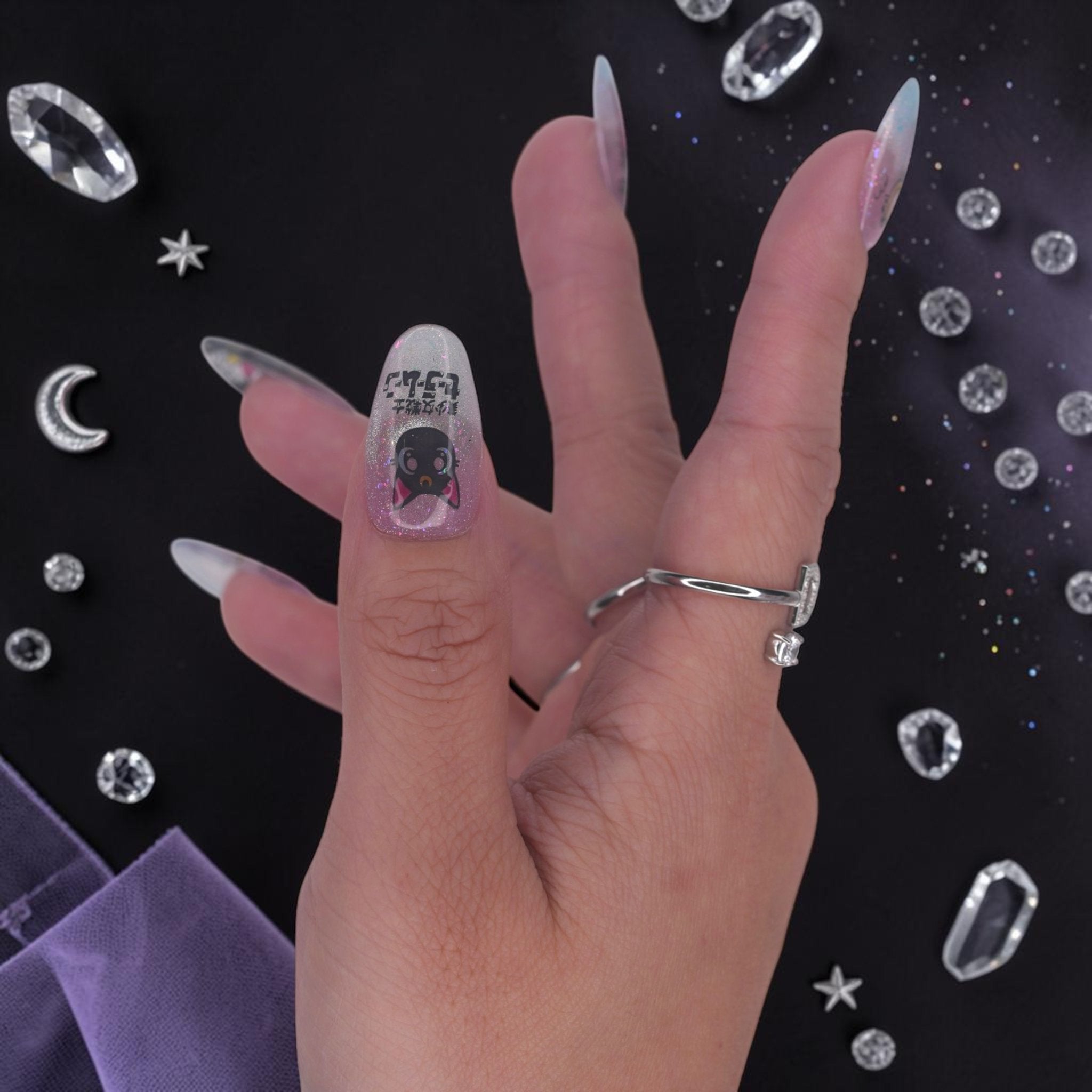 DSC00015 close up of celestial anime press on nails with a black cat and moon wand