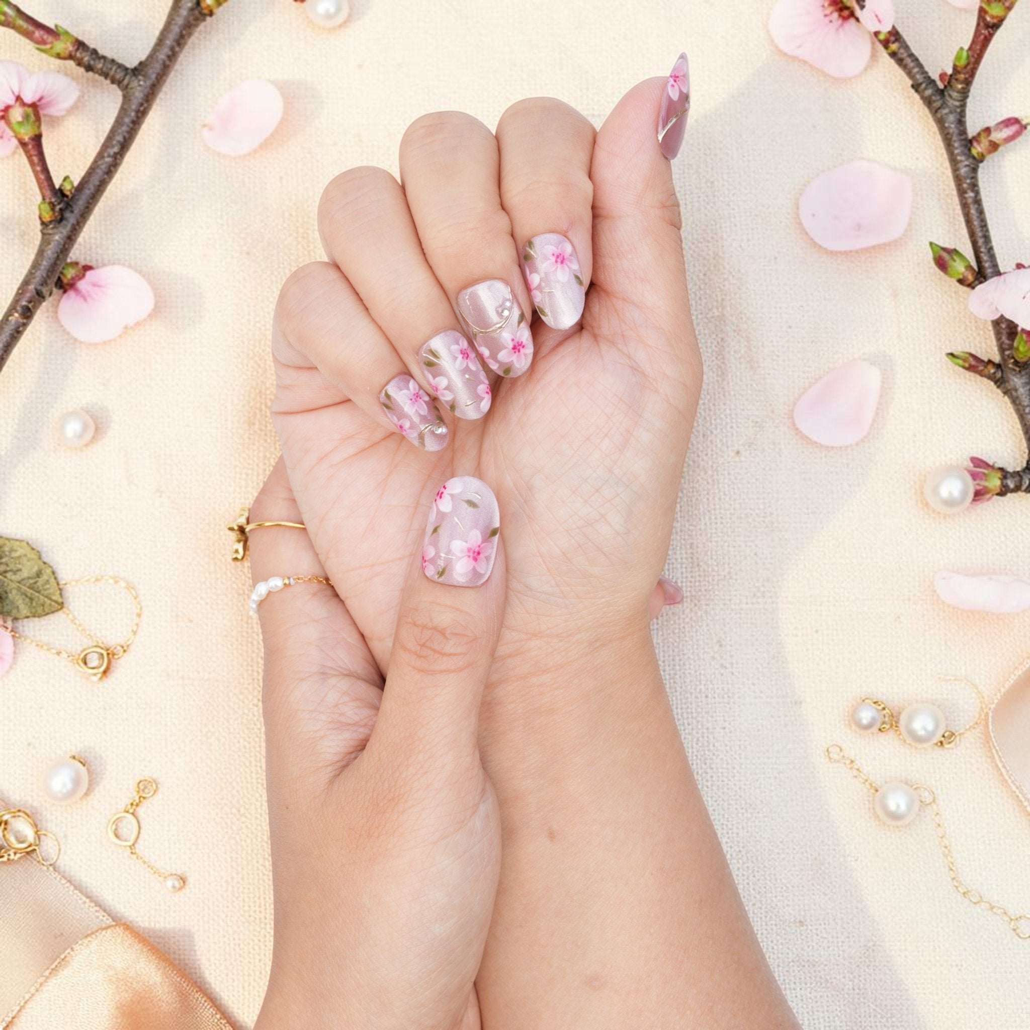 DSC00016 pink sakura press on nails held with a cherry blossom branch