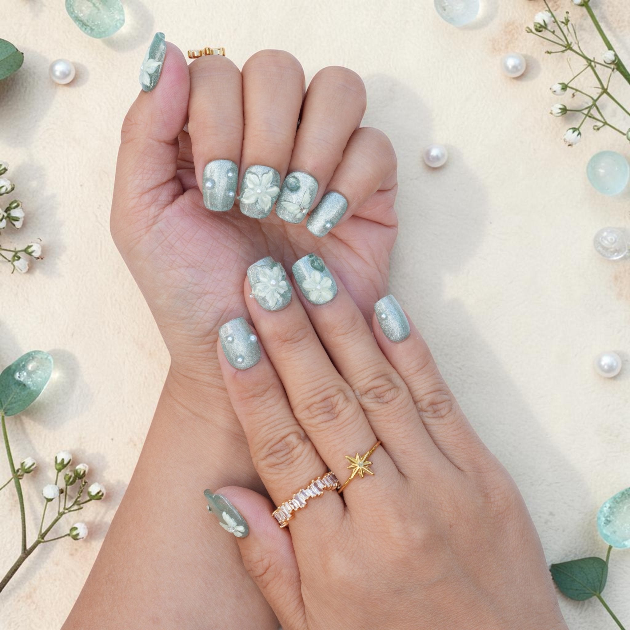 DSC00023 close up of sage green press on nails with 3D white flowers and a butterfly