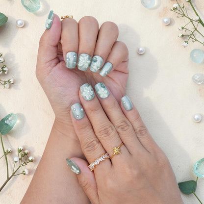 DSC00023 close up of sage green press on nails with 3D white flowers and a butterfly