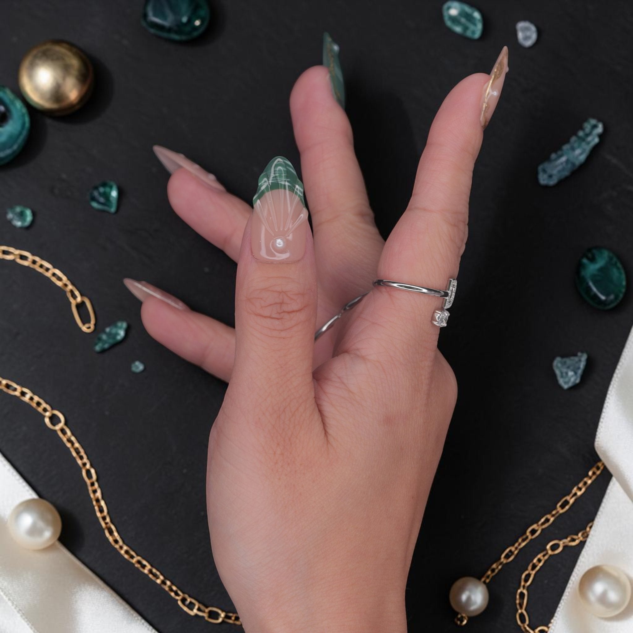 DSC00032 close up of emerald press on nails with molten gold framing and pearl accents