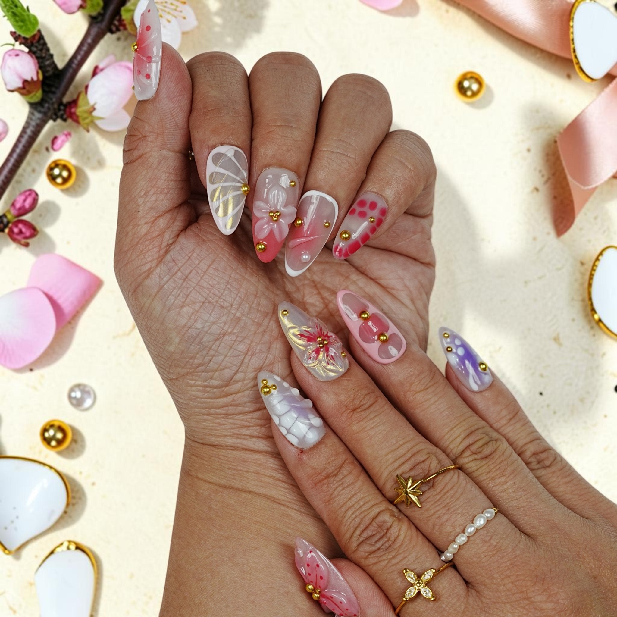 DSC00034 two hands showing ethereal fairy press on nails with 3D wings and blossoms