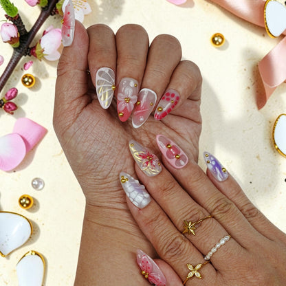 DSC00034 two hands showing ethereal fairy press on nails with 3D wings and blossoms
