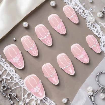 DSC00037 coquette press on nails full set with soft pink french tips, 3D flowers, pearls and silver hearts laid flat