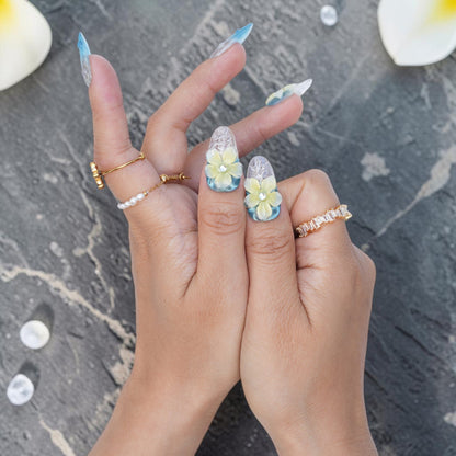 DSC00040 close up of 3D frangipani flowers on blue water print press on nails